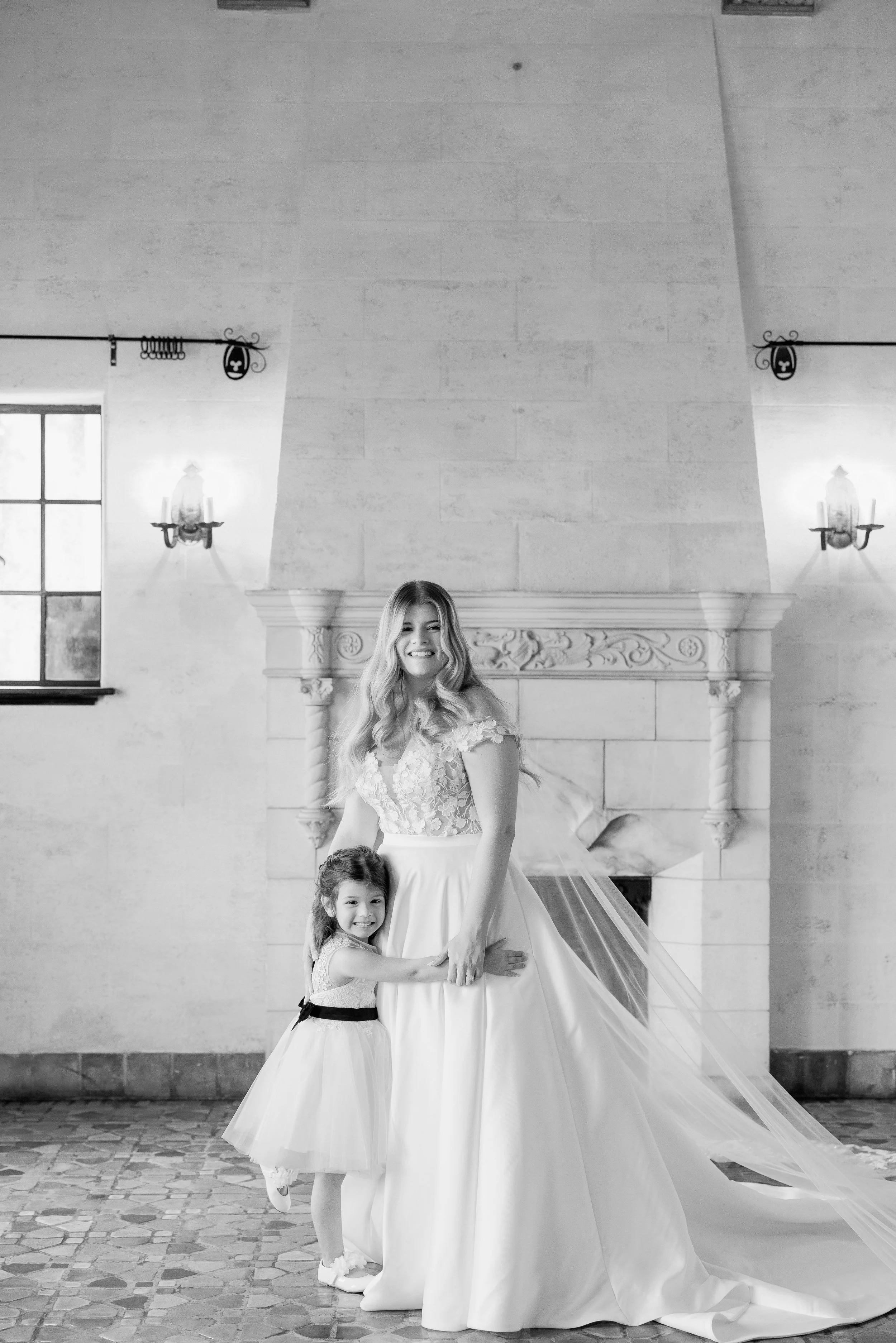 bride-bridesmaid-candid-getting-ready-black-and-white-powel-crosley-estate-wedding-sarasota.jpg