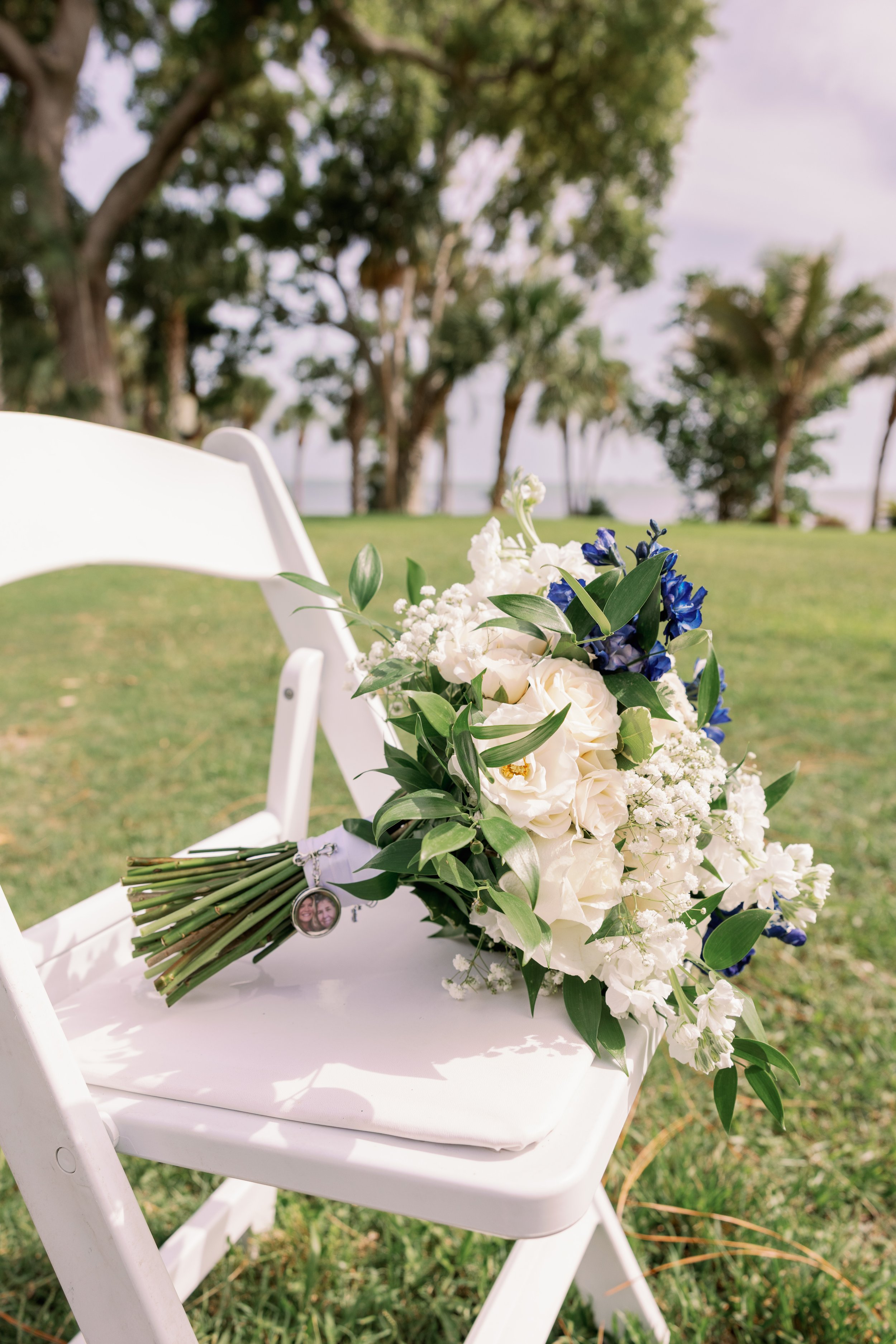 ceremony-floral-arch-detail-white-blue-flowers-powel-crosley-estate-wedding-sarasota.jpg