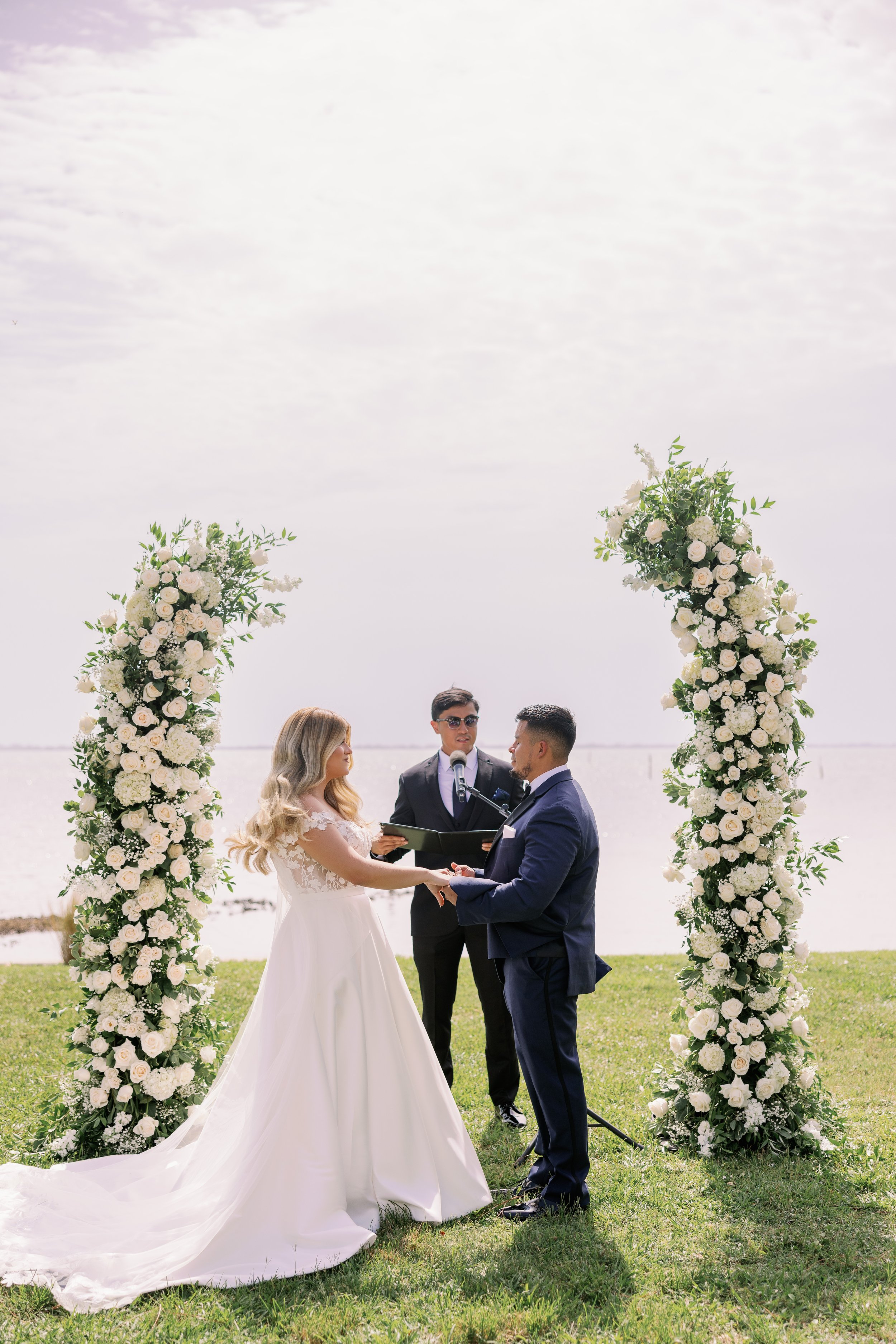 ceremony-vow-exchange-officiant-floral-arch-powel-crosley-estate-wedding-sarasota.jpg