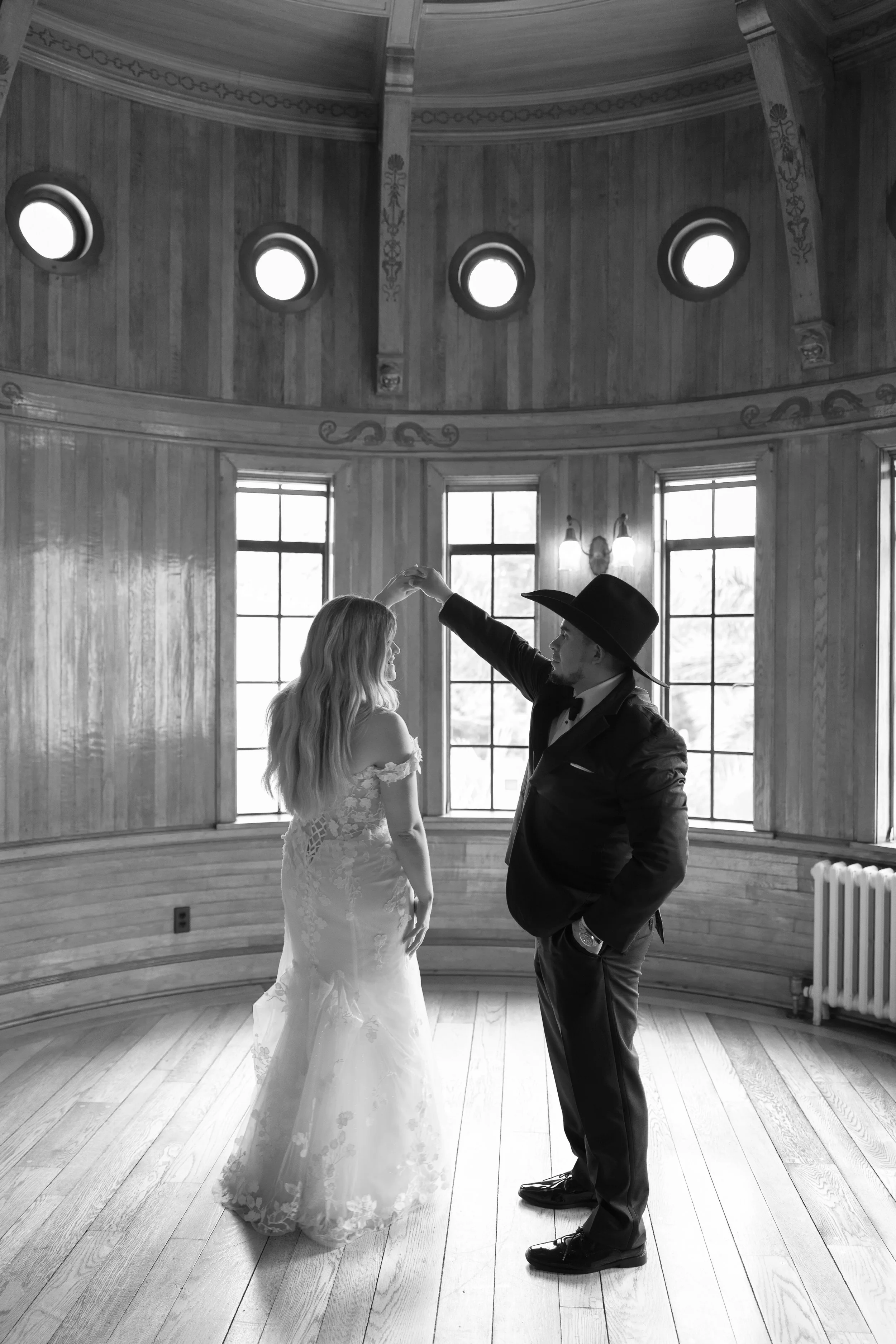 first-dance-black-and-white-round-window-reception-hall-powel-crosley-estate-wedding-sarasota.jpg