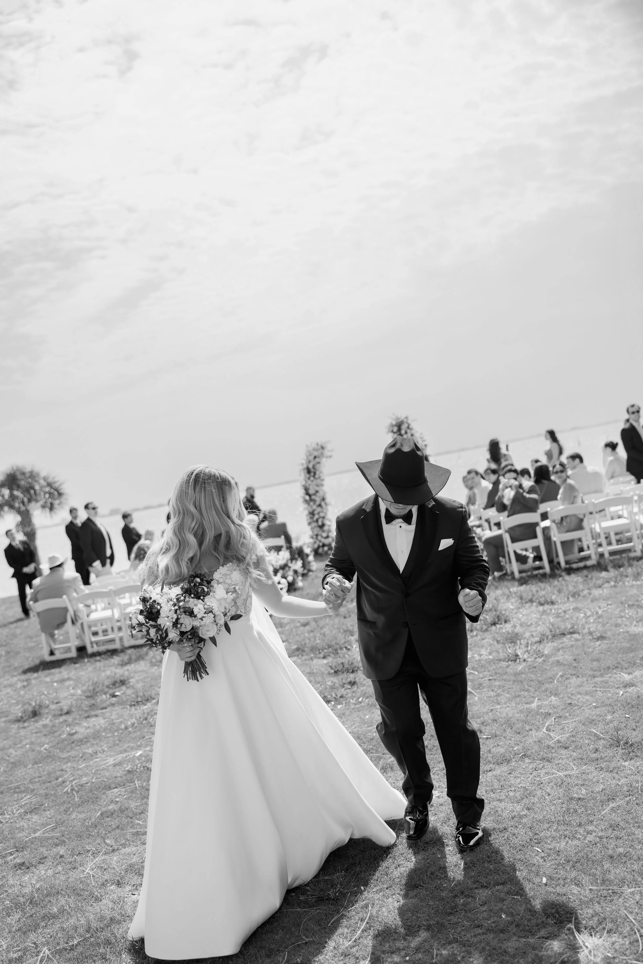 groomsmen-procession-walking-black-and-white-powel-crosley-estate-wedding-sarasota.jpg
