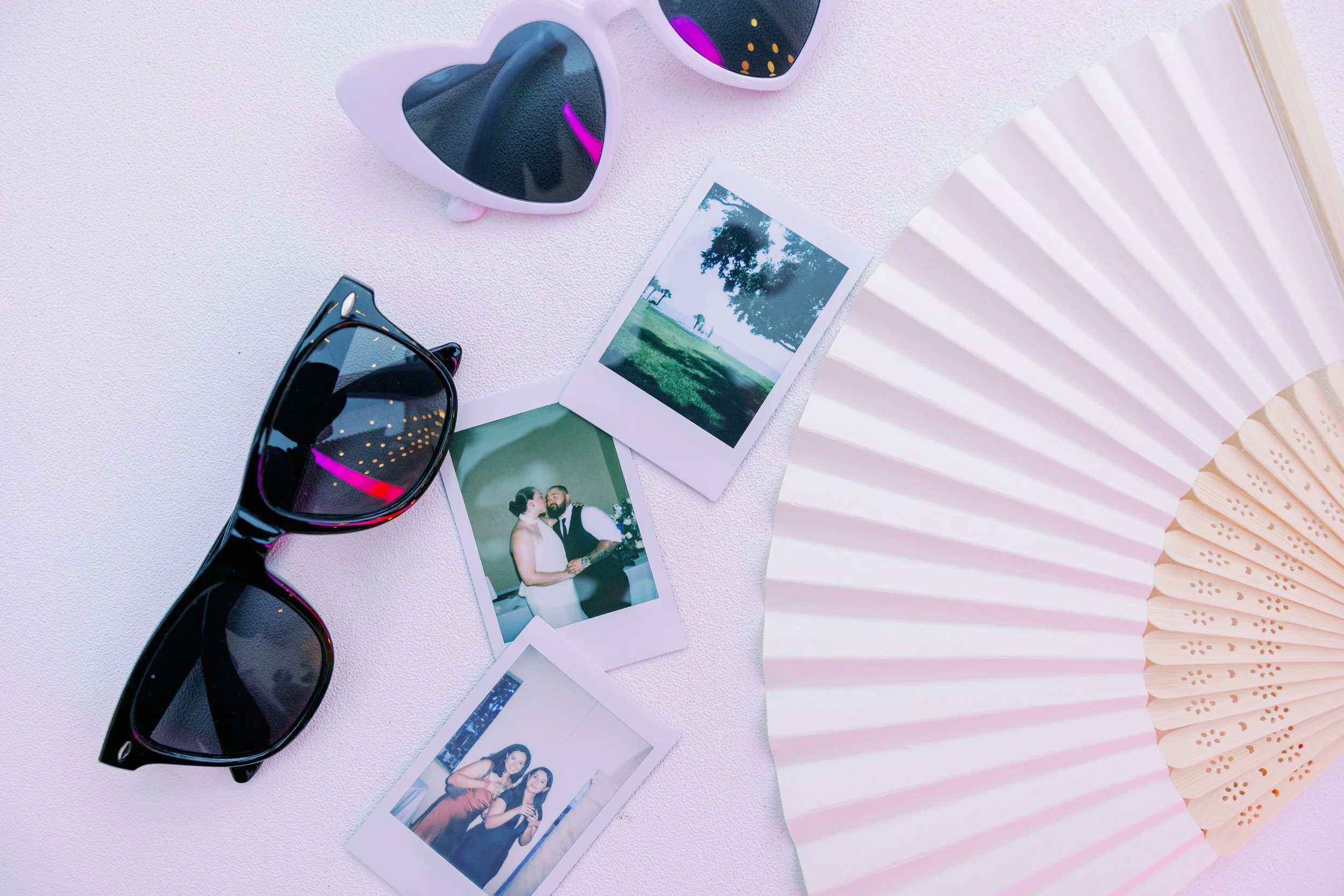 guest-favors-sunglasses-fans-reception-table-powel-crosley-estate-wedding-sarasota.jpg
