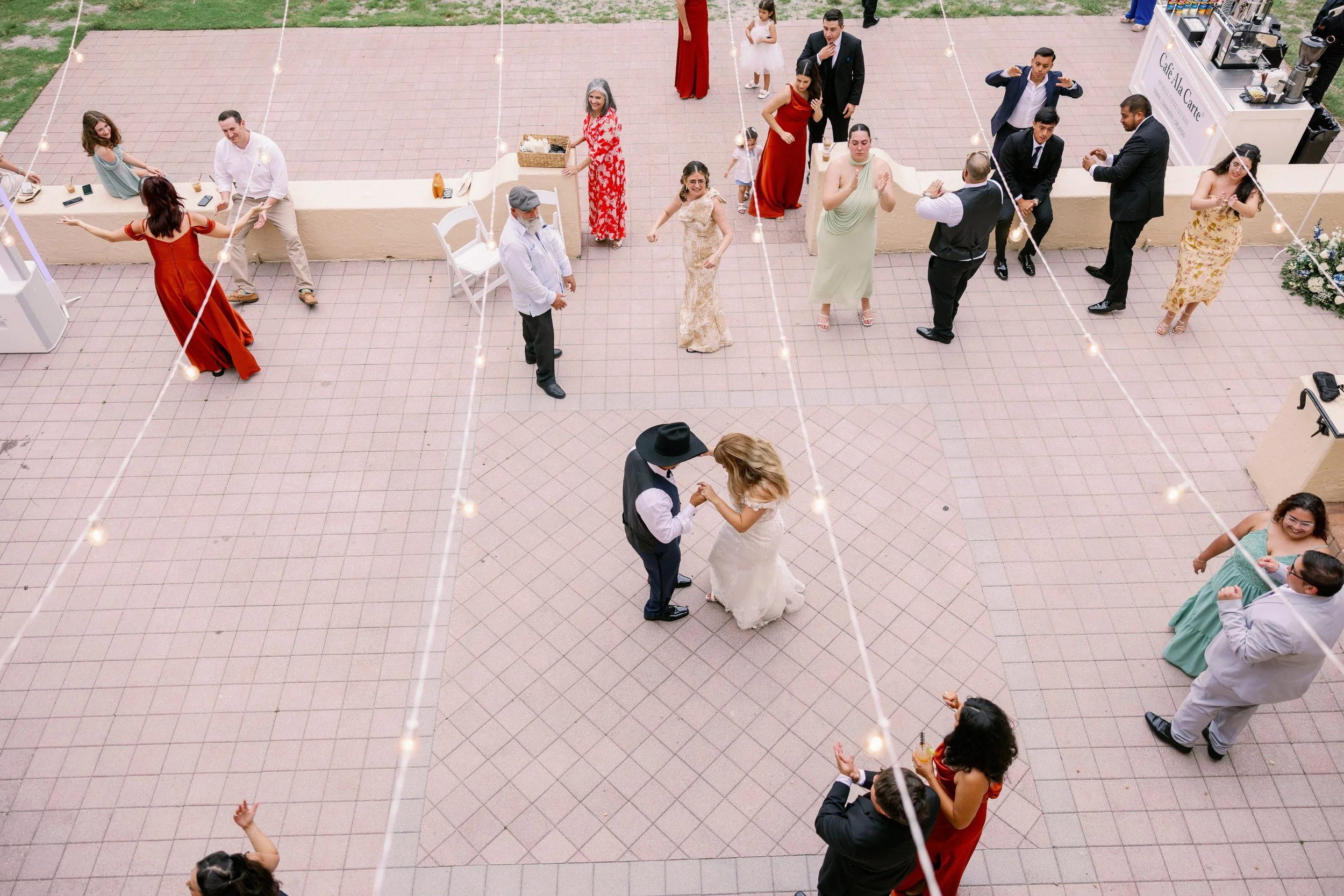 reception-dance-floor-guests-dancing-string-lights-powel-crosley-estate-wedding-sarasota.jpg