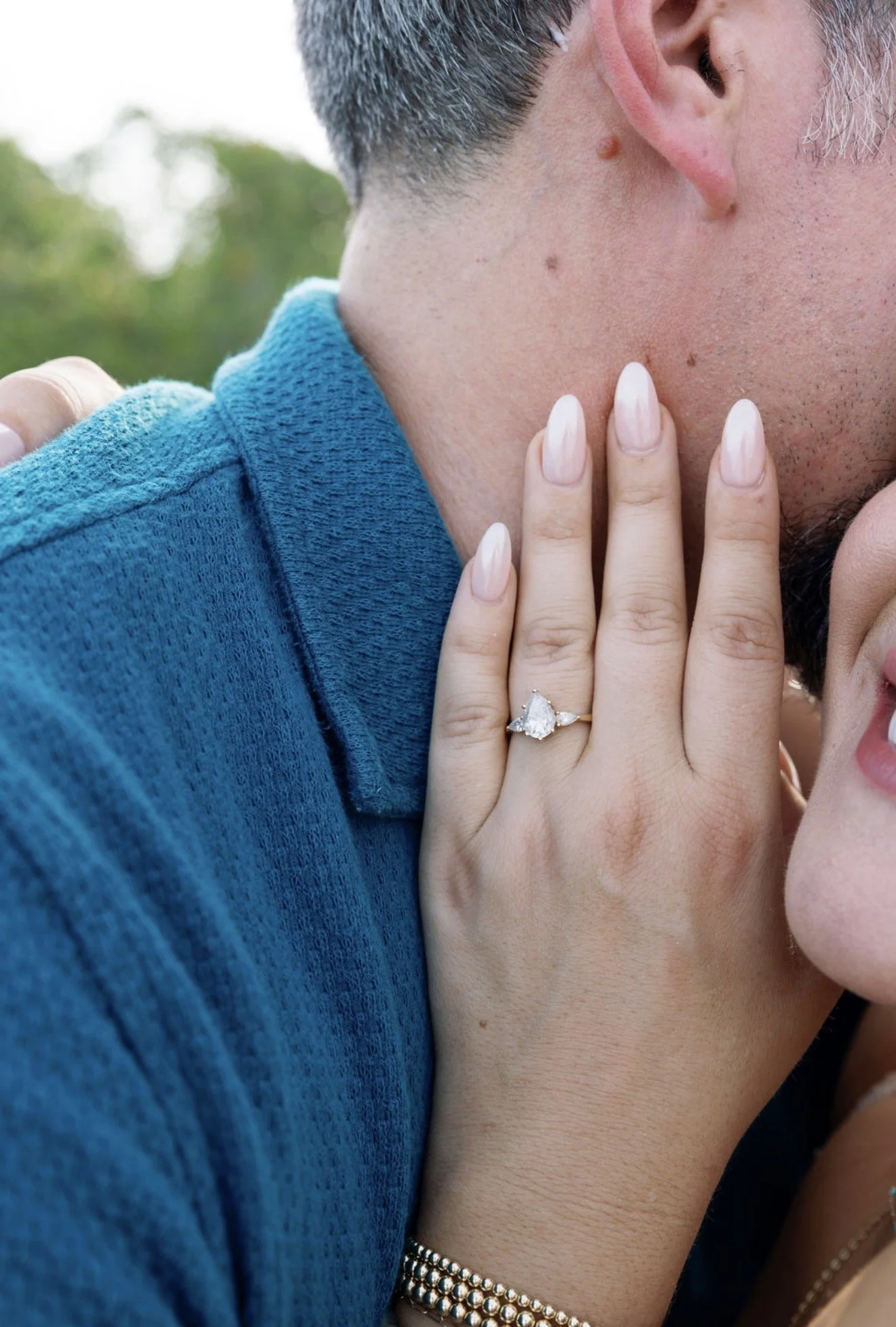 couple-close-portrait-ring-detail-anna-maria-island-wedding-weekend.png