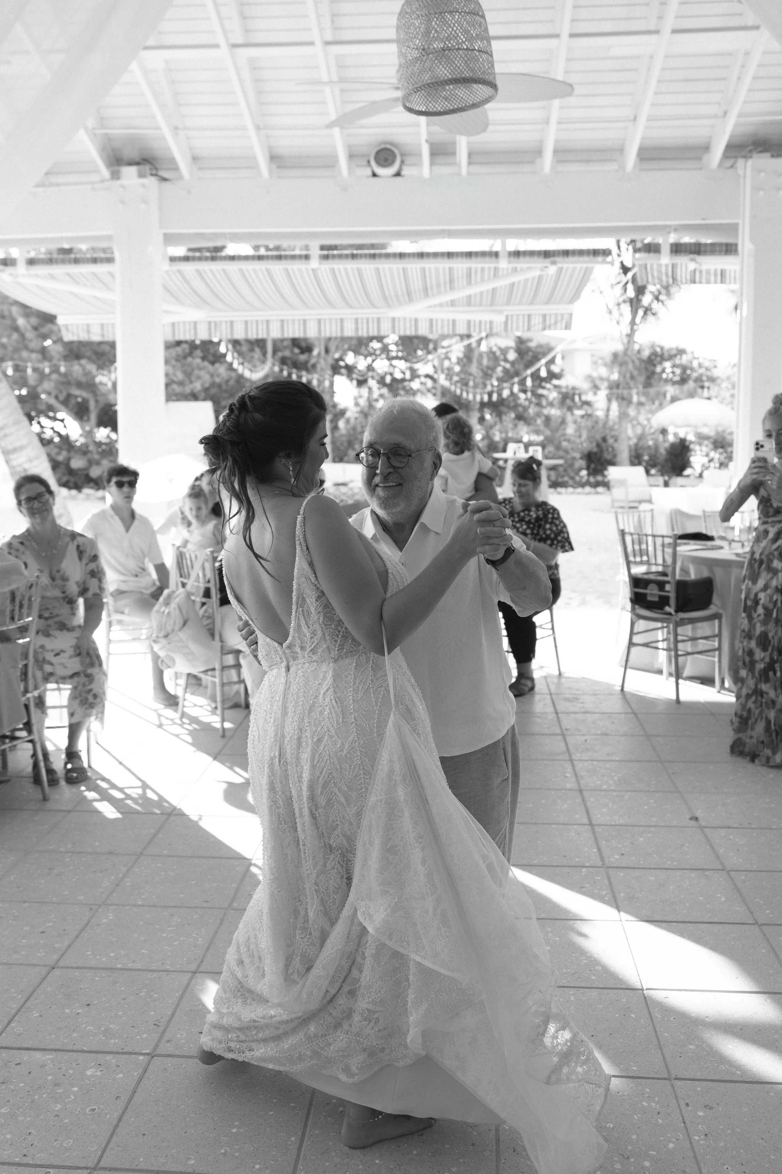 bride-dancing-solo-candid-black-and-white-grand-pavilion-sandbar-wedding.jpg