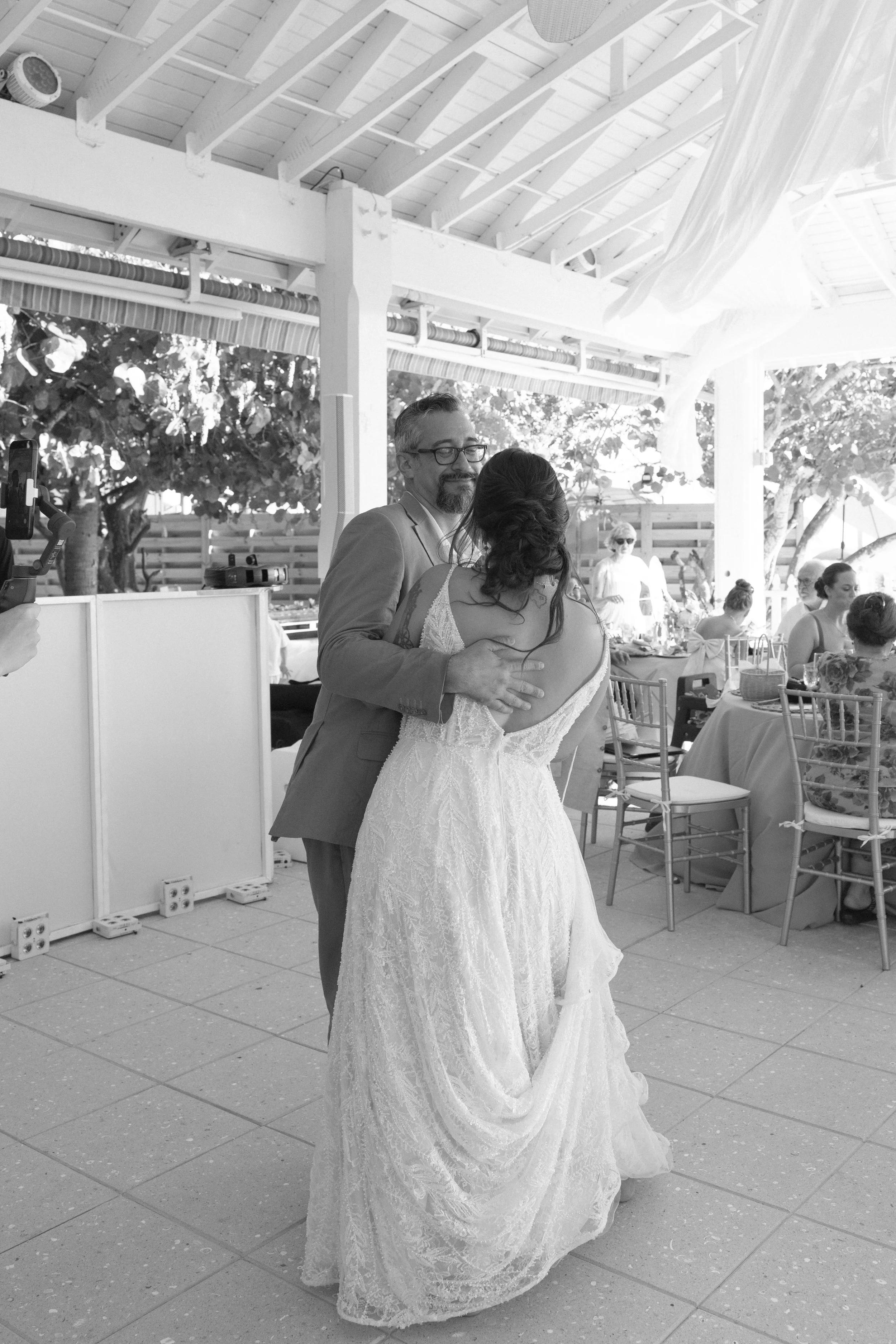 bride-dancing-solo-indoor-reception-grand-pavilion-sandbar-wedding.jpg