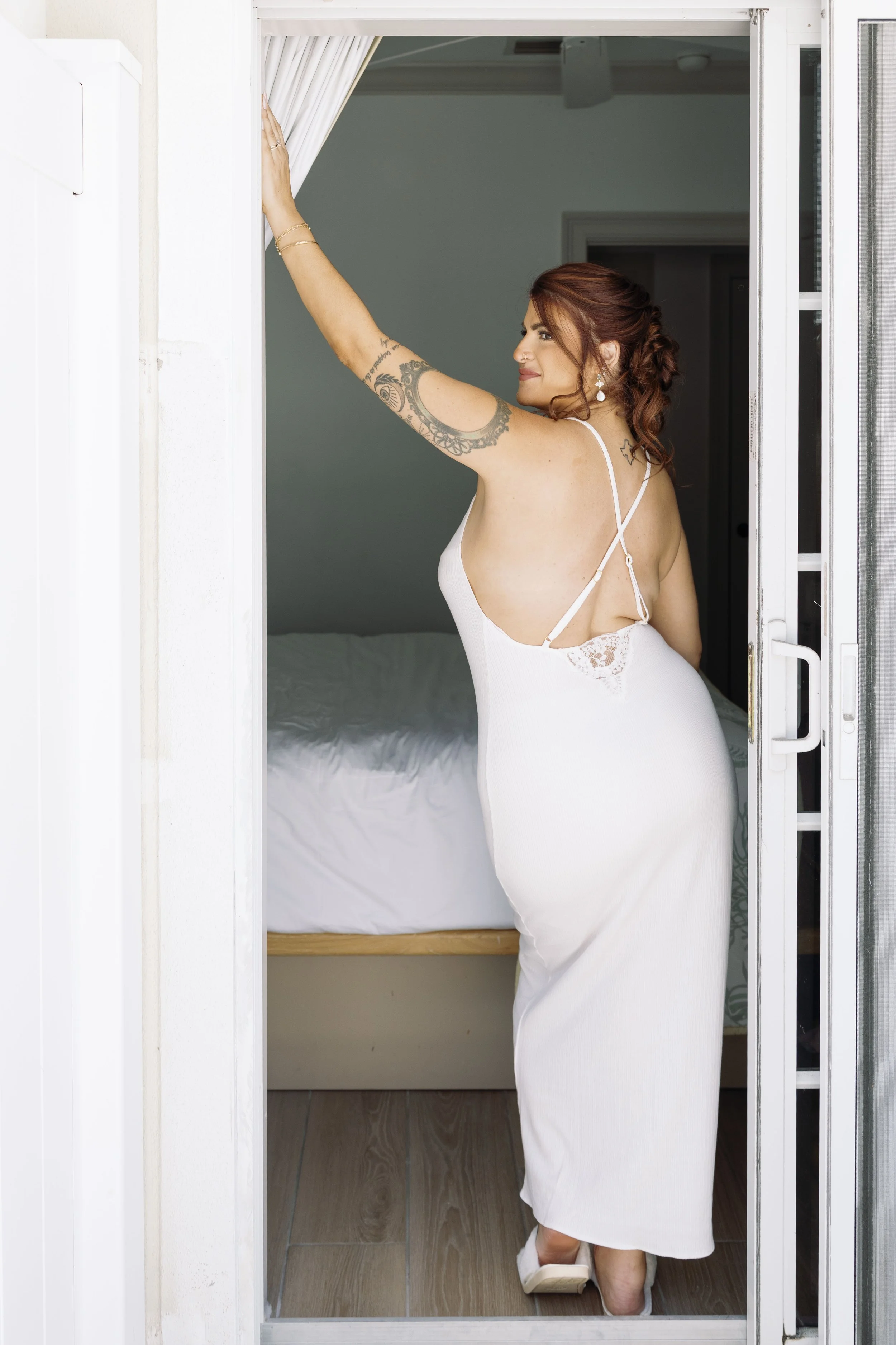 bride-doorway-getting-ready-candid-anna-maria-island-wedding.jpg