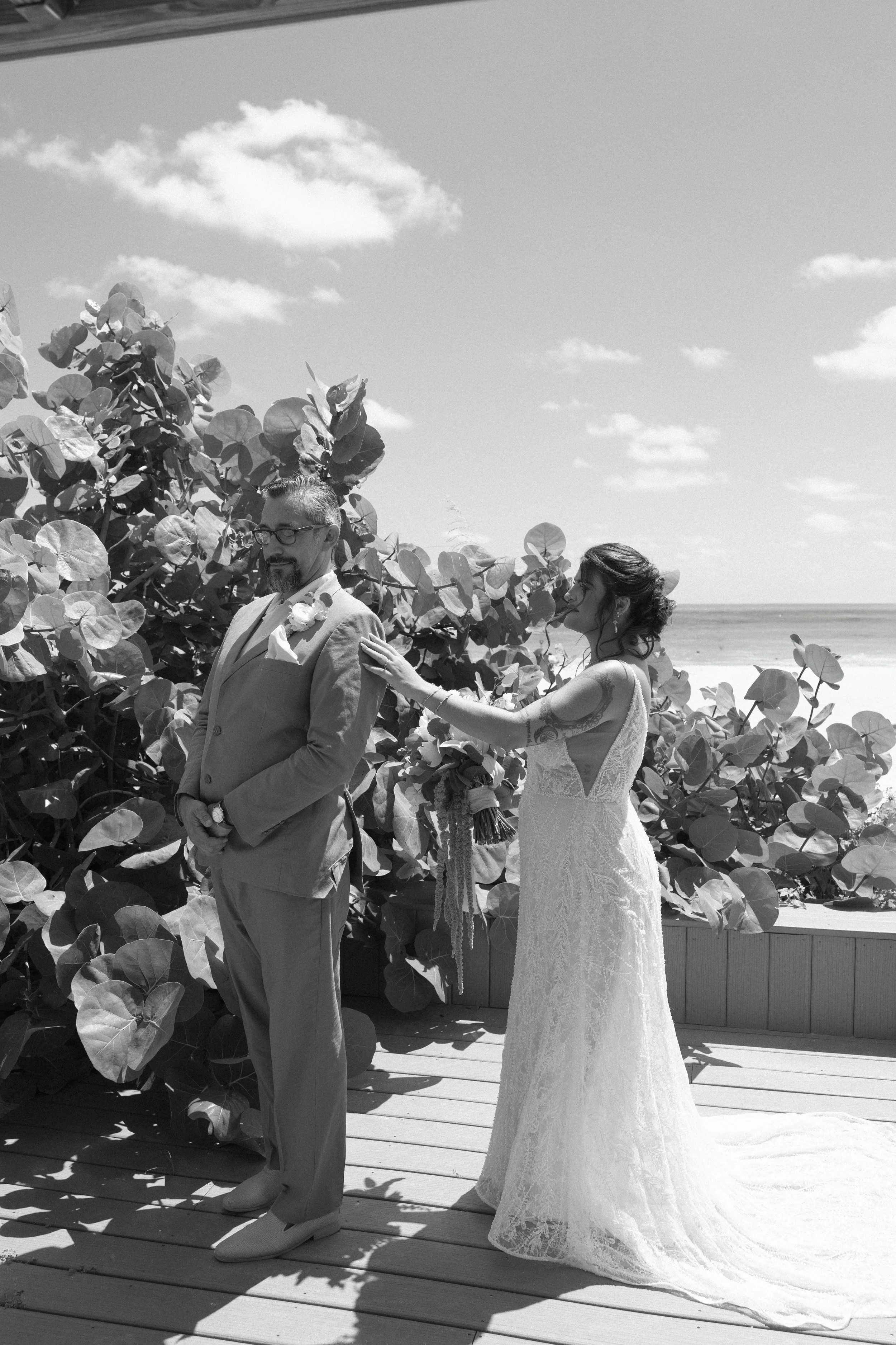 bride-father-embrace-before-ceremony-grand-pavilion-sandbar-wedding.jpg