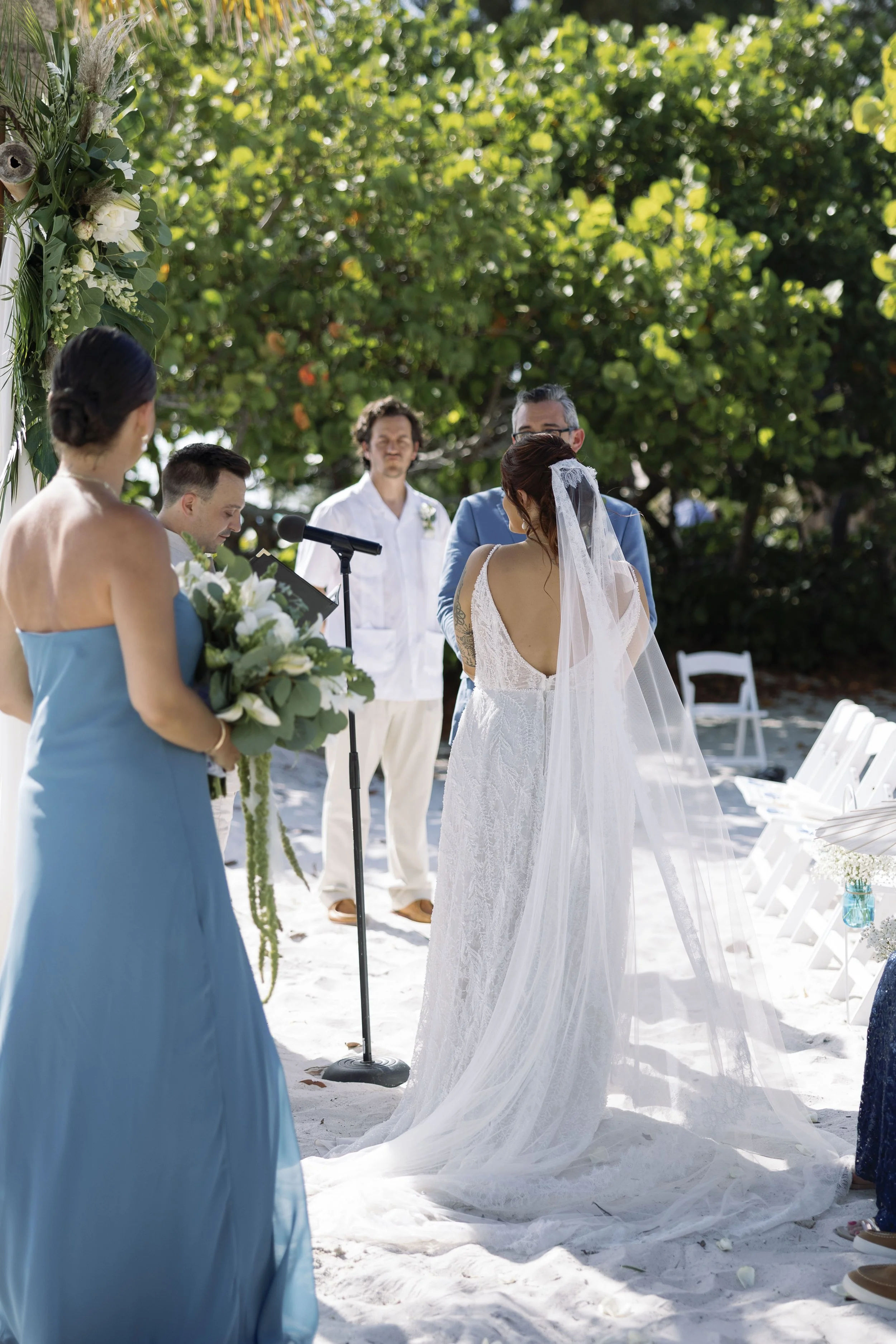 bride-portrait-veil-flowing-beach-grand-pavilion-sandbar-anna-maria-island-wedding.jpg