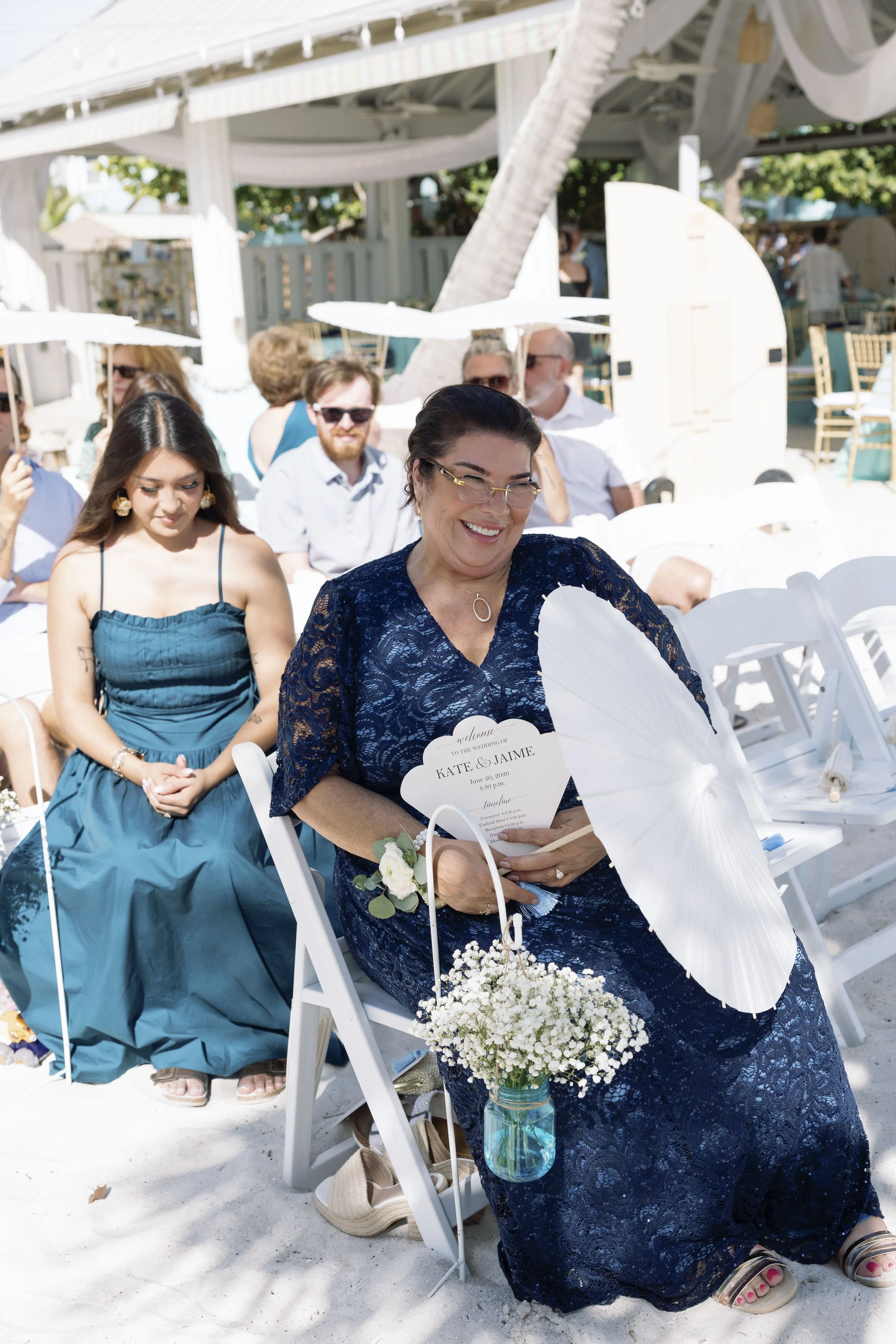 bridesmaids-group-seated-black-and-white-grand-pavilion-sandbar-wedding.jpg