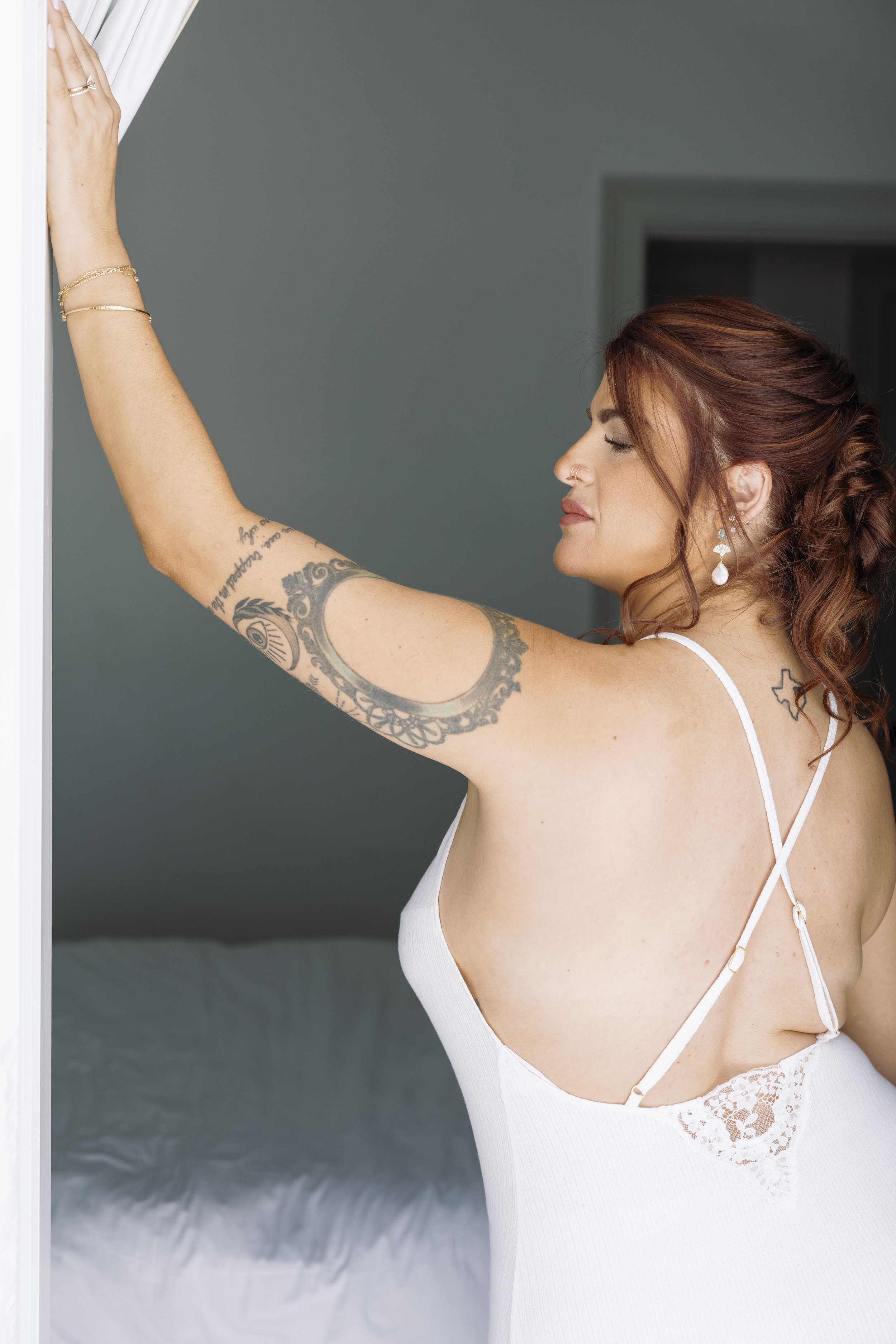bride-solo-portrait-backless-dress-getting-ready-anna-maria-island-wedding.jpg