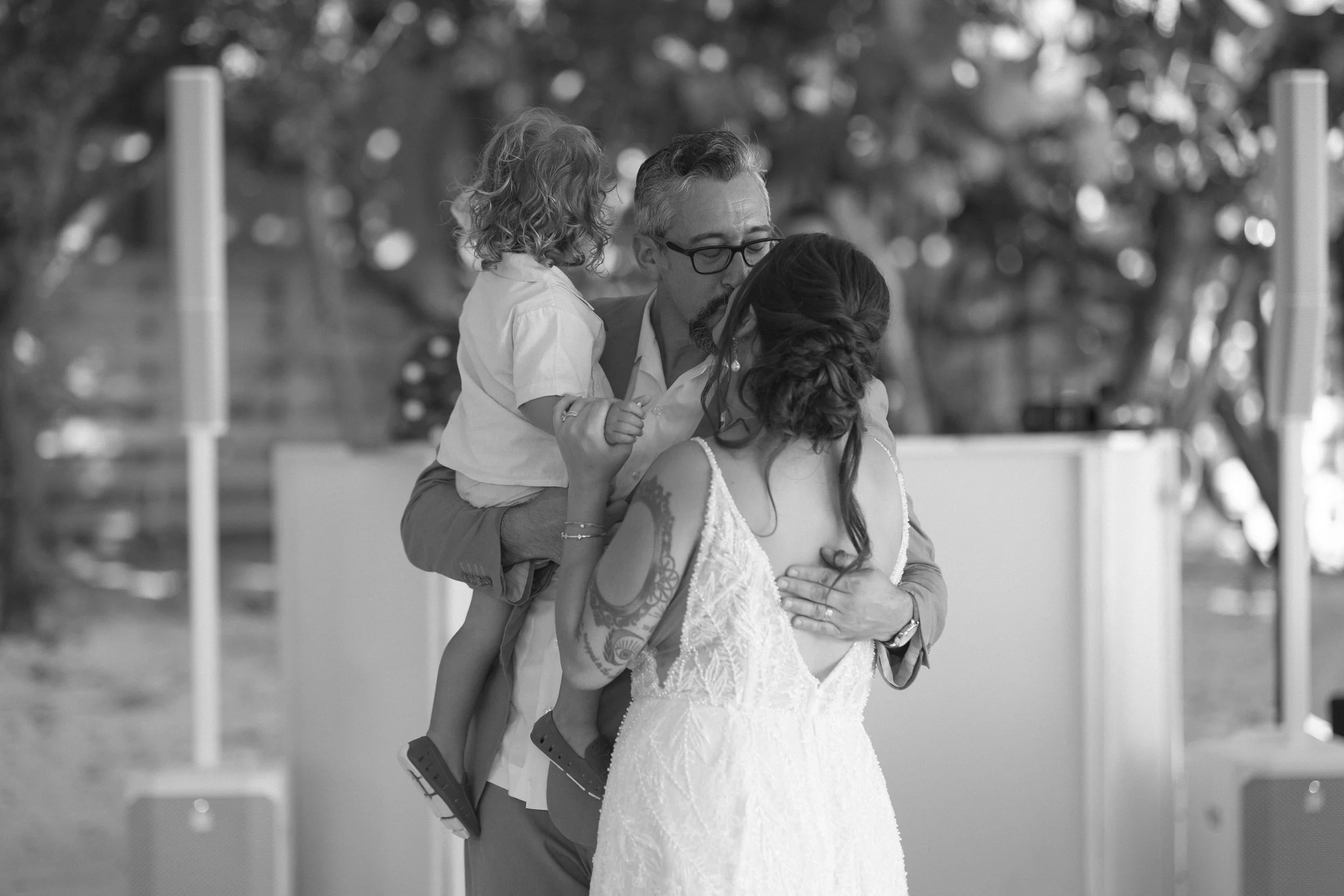 bride-walking-alone-beach-candid-anna-maria-island-wedding.jpg