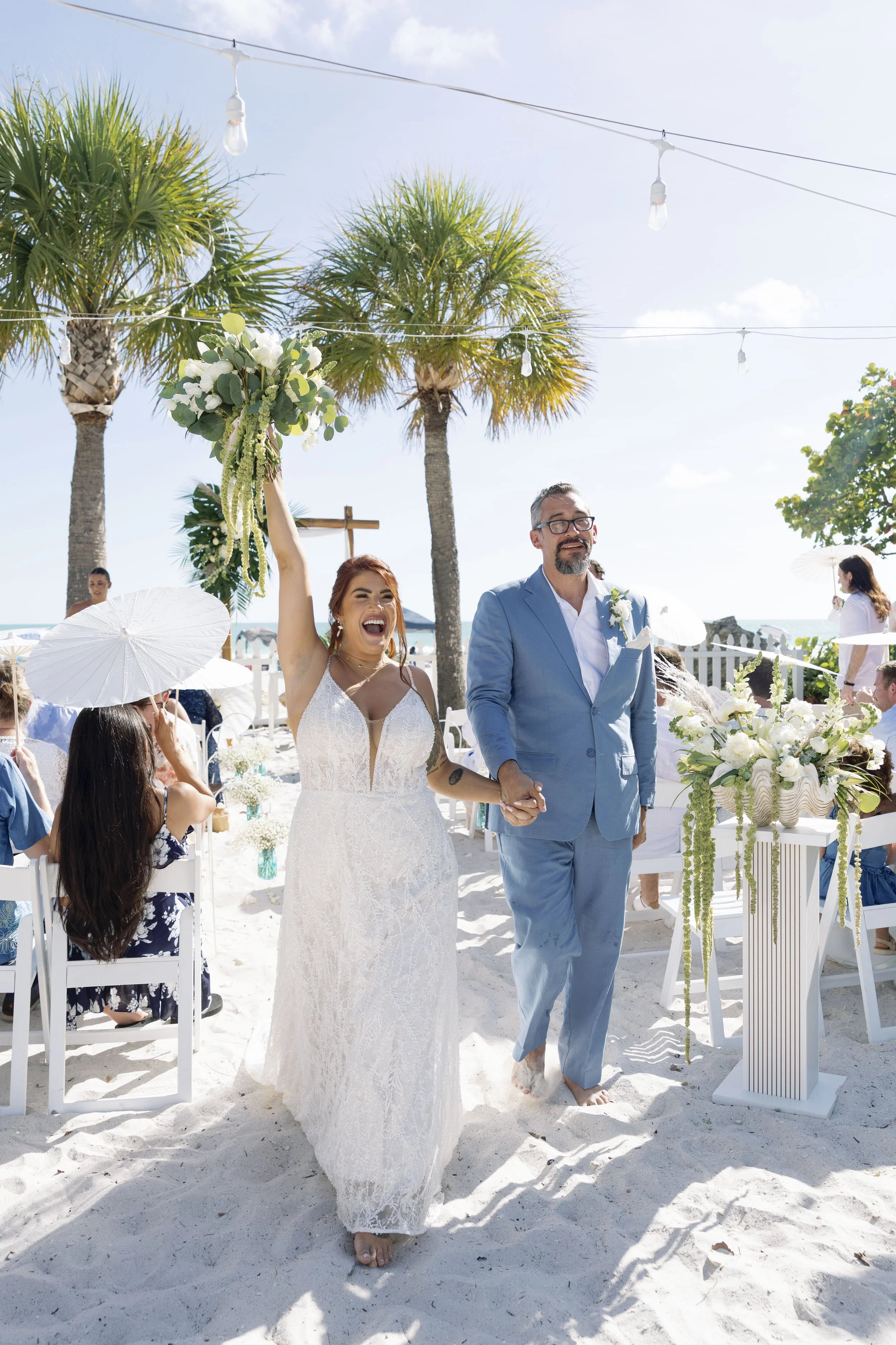 bride-walking-sandy-aisle-beach-ceremony-grand-pavilion-sandbar-anna-maria-island-wedding.jpg