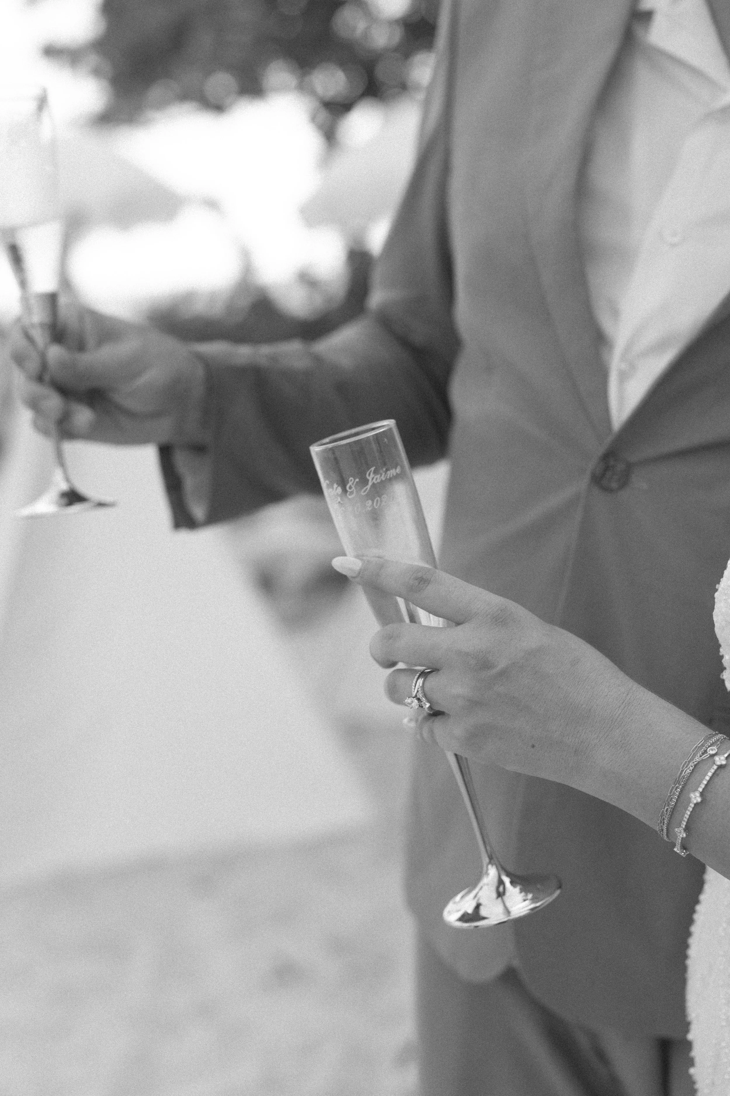 champagne-toast-detail-blue-ribbon-grand-pavilion-sandbar-wedding.jpg