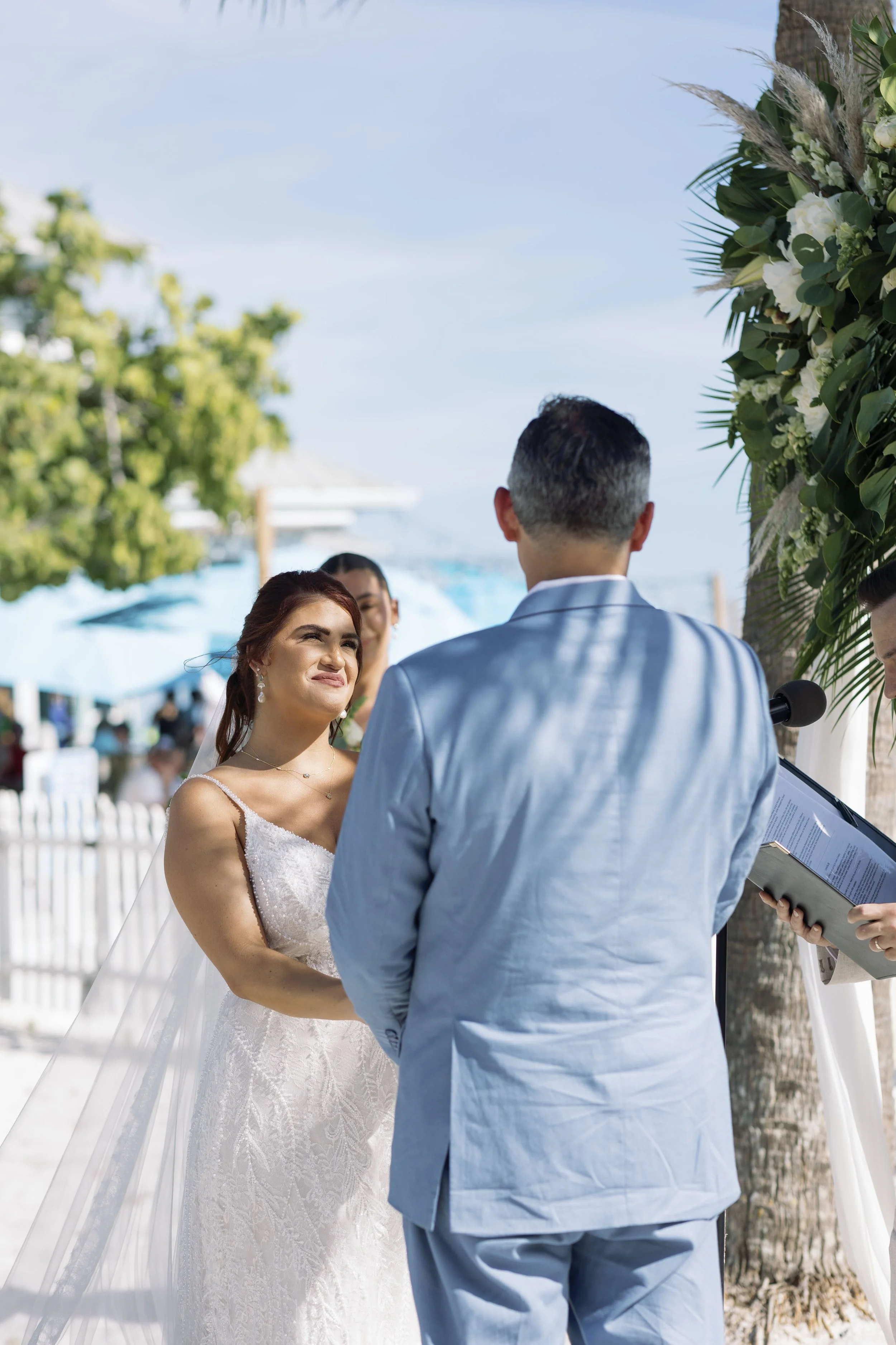 couple-dancing-close-embrace-outdoor-patio-grand-pavilion-sandbar-wedding.jpg