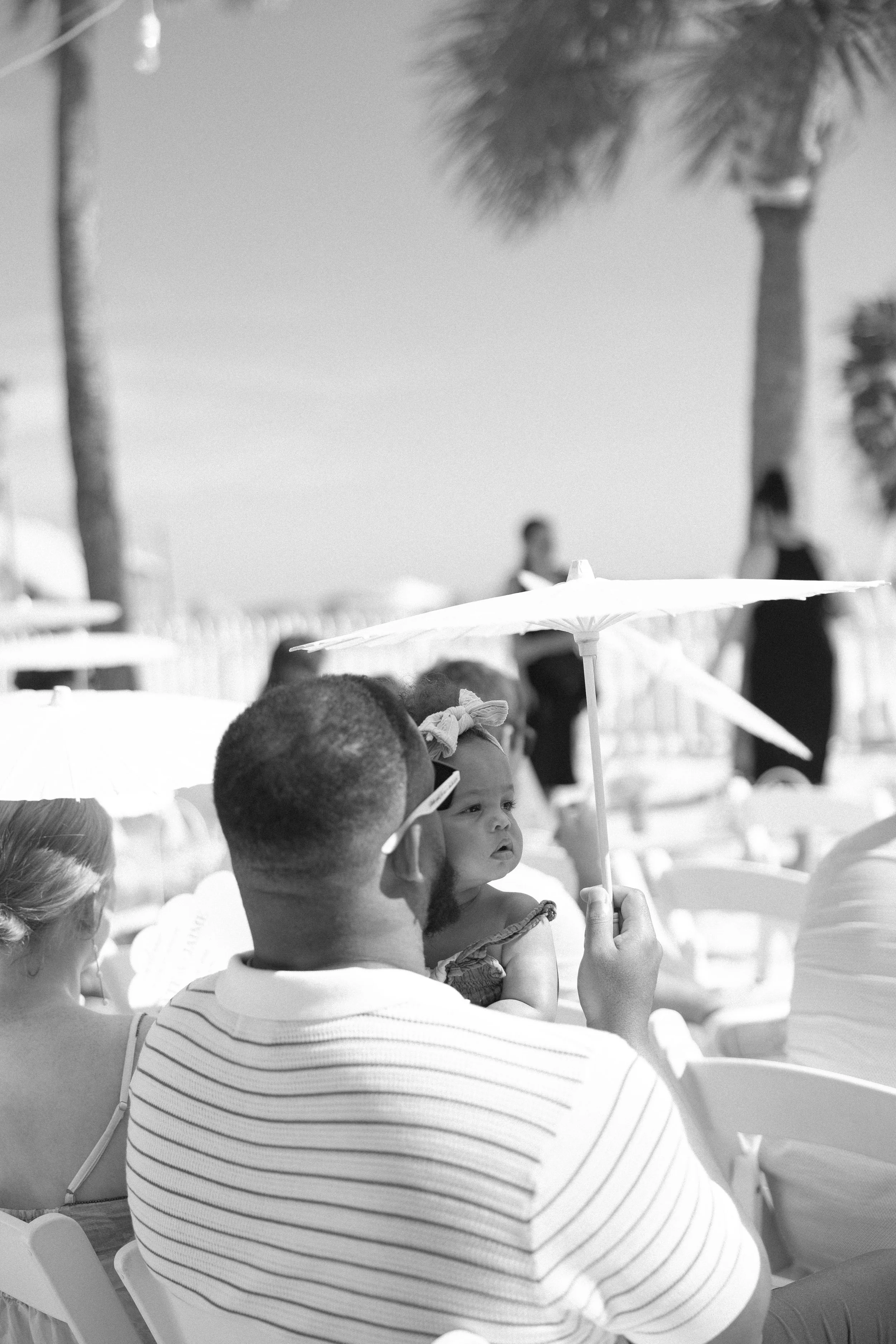 groomsmen-candid-ceremony-black-and-white-grand-pavilion-sandbar-wedding.jpg