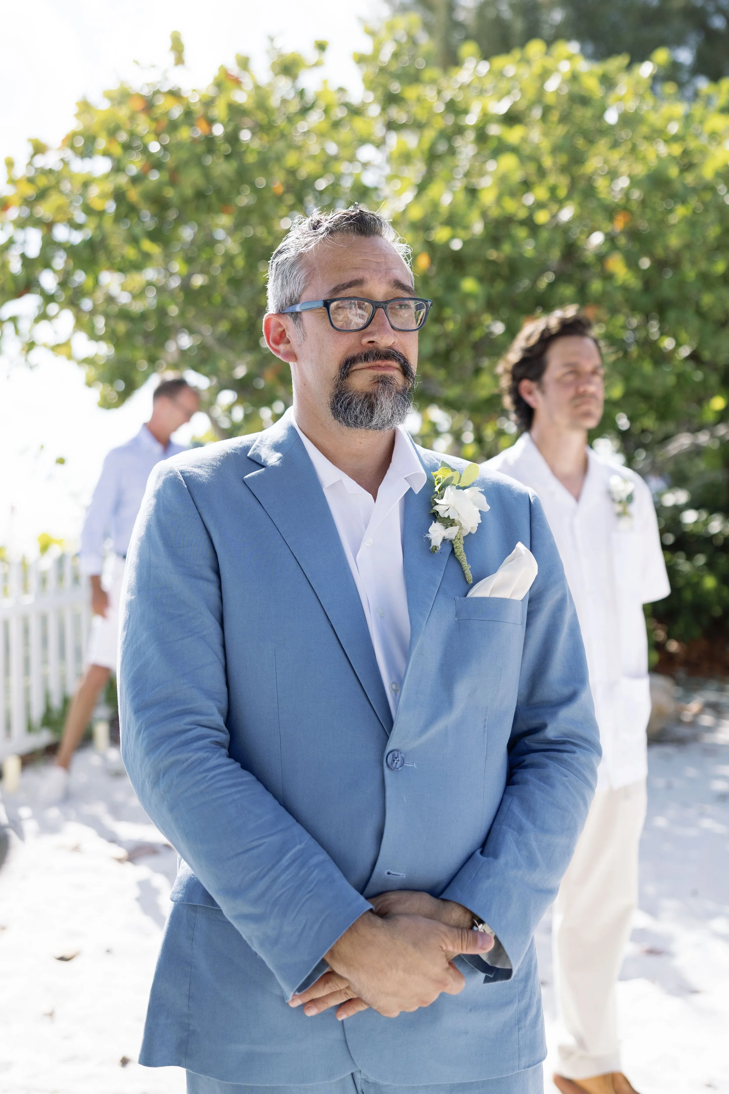 groom-solo-portrait-light-blue-suit-boutonniere-grand-pavilion-sandbar-wedding.jpg