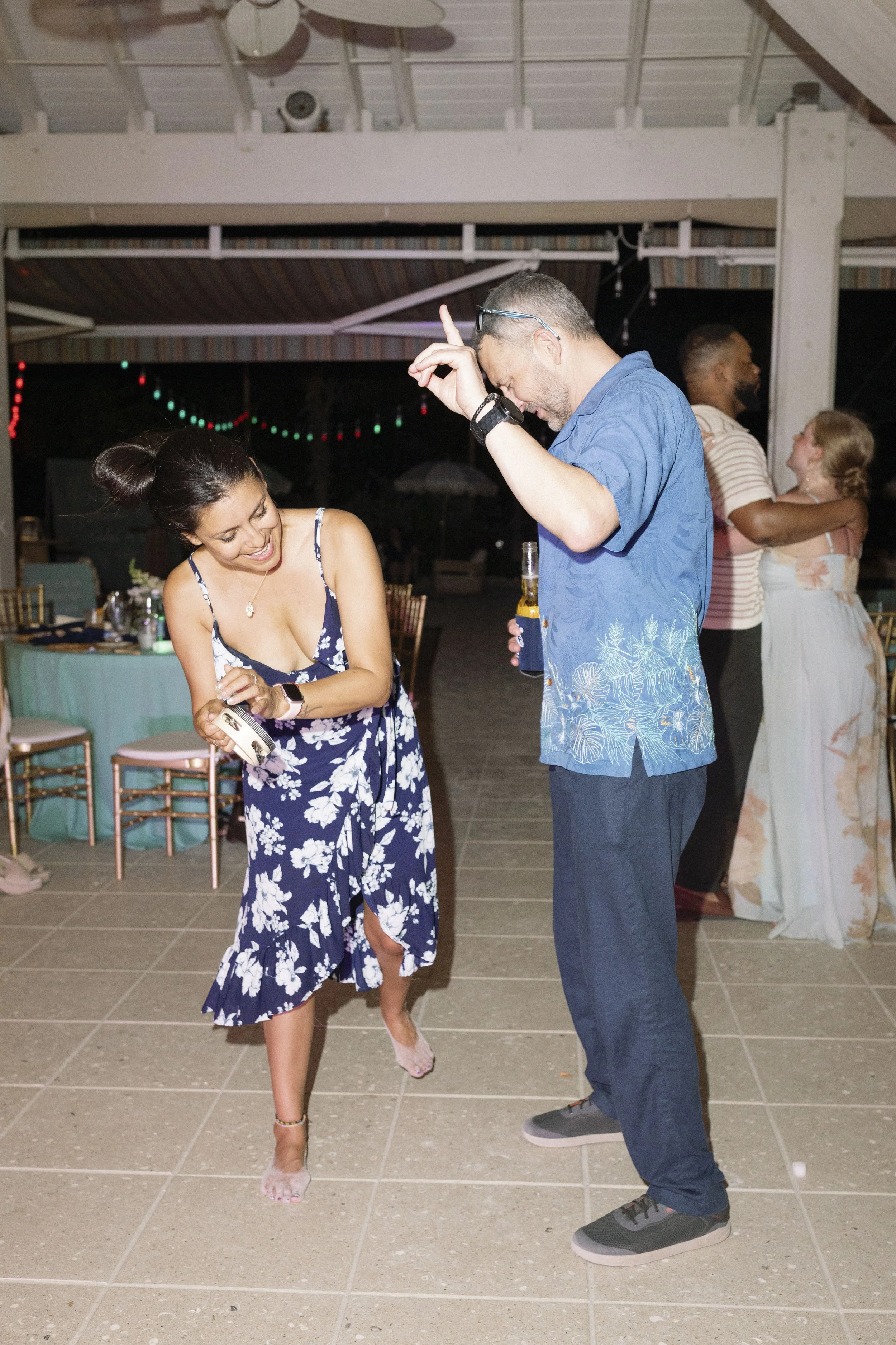 guest-dancing-candid-navy-dress-reception-grand-pavilion-sandbar-wedding.jpg