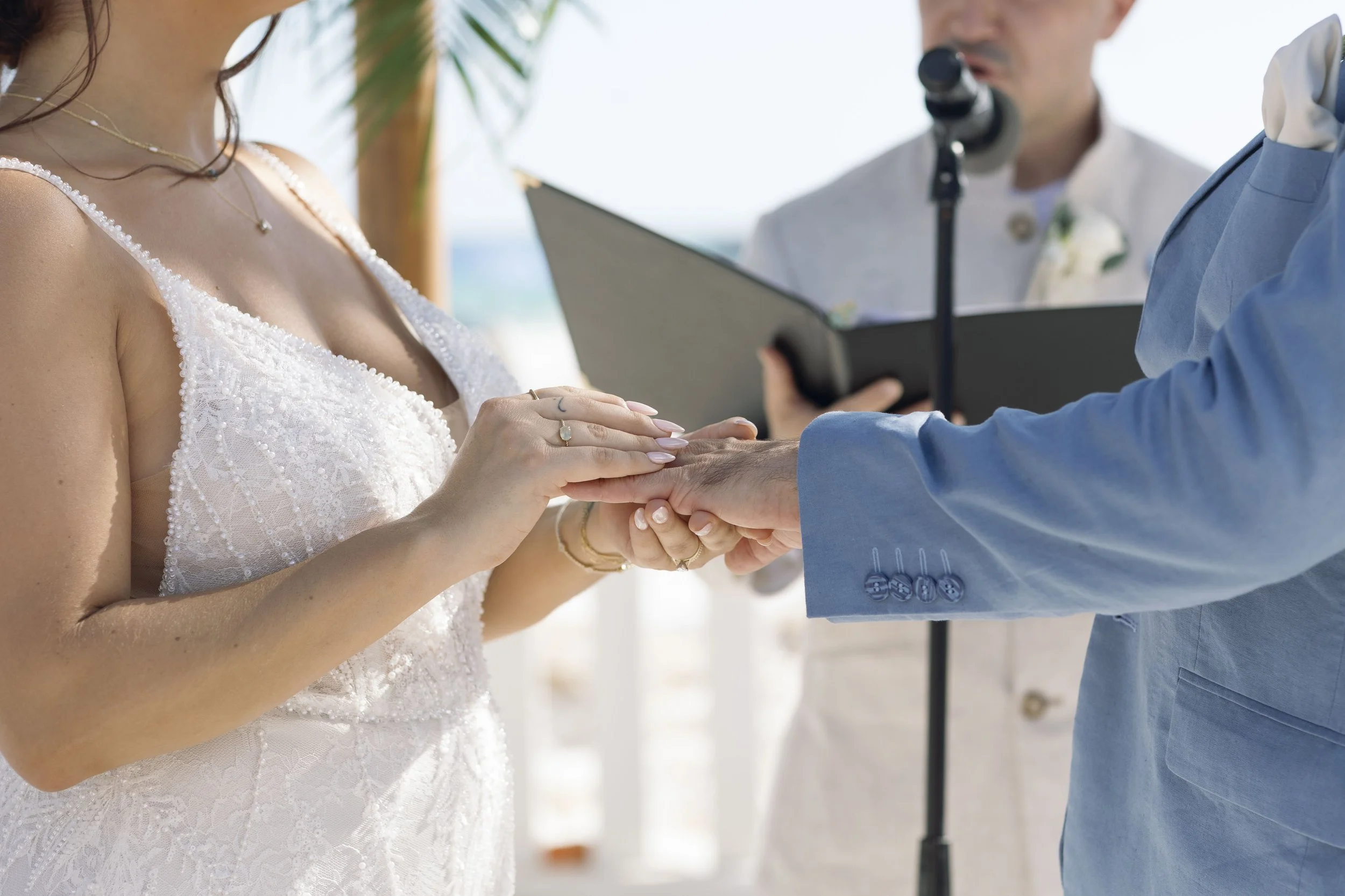 officiant-reading-close-up-grand-pavilion-sandbar-wedding.jpg