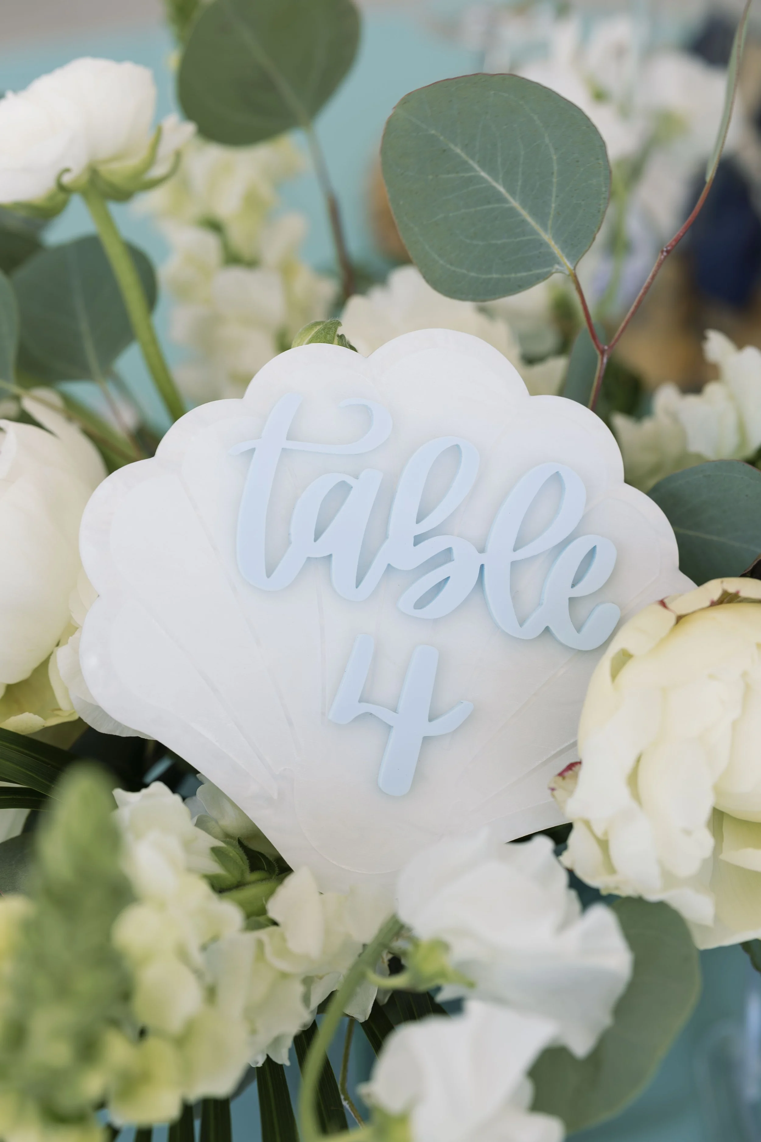 table-number-floral-shell-detail-grand-pavilion-sandbar-wedding.jpg
