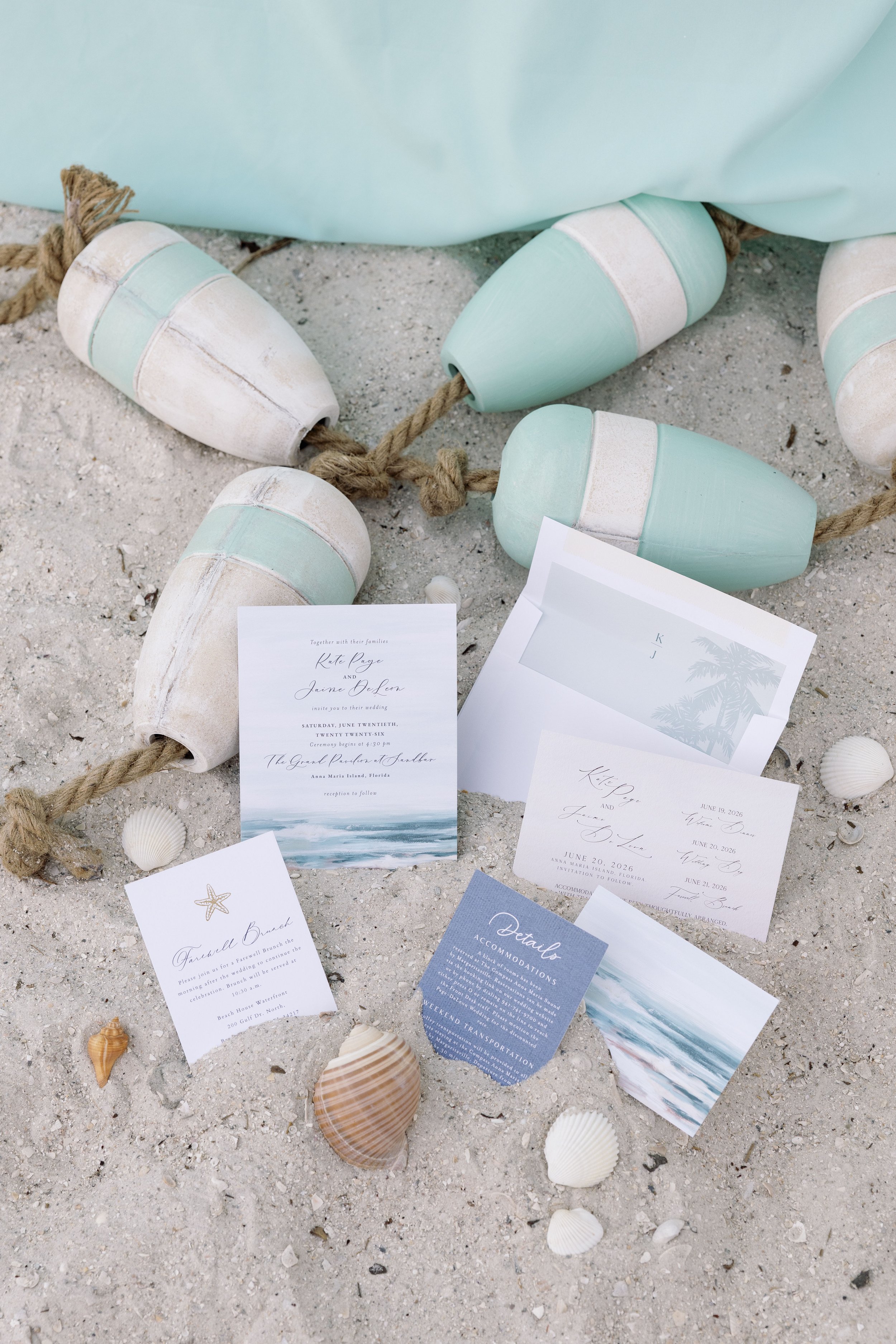 wedding-invitation-suite-shells-sand-flatlay-anna-maria-island-wedding.jpg