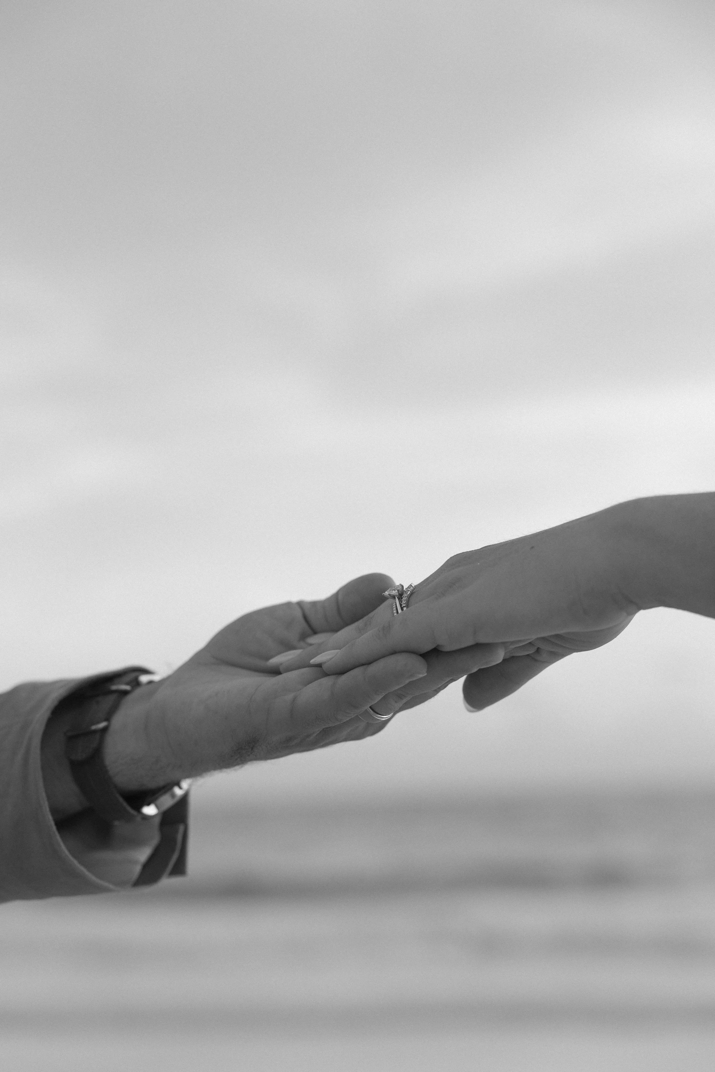 wedding-ring-hand-detail-black-and-white-grand-pavilion-sandbar-wedding.jpg