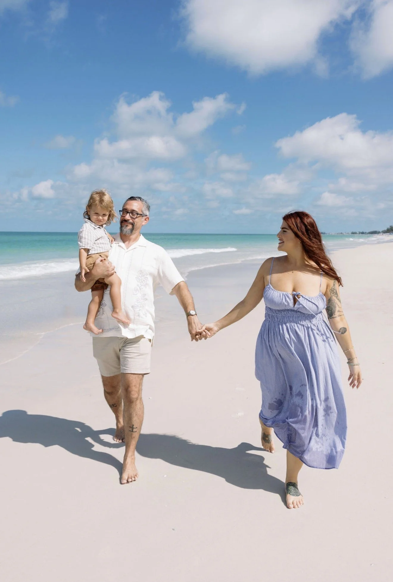 couple-walking-hand-in-hand-beach-portrait-anna-maria-island-wedding.png