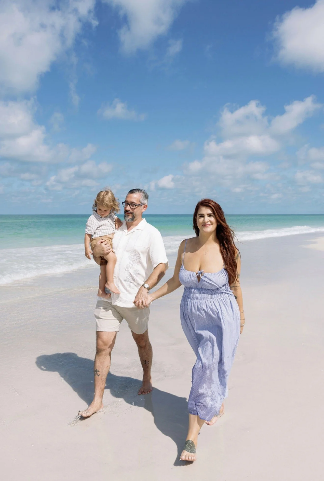 couple-walking-laughing-beach-portrait-anna-maria-island-wedding.png