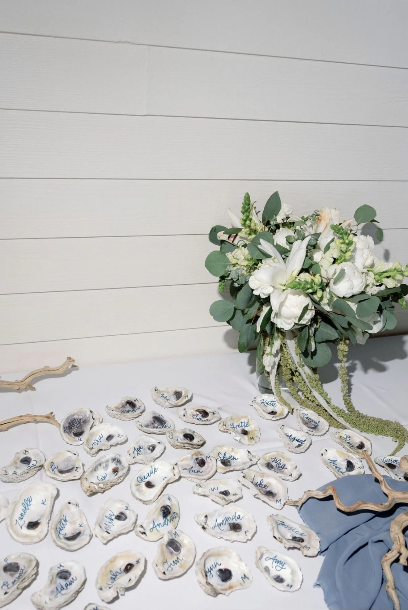 floral-centerpiece-shell-place-cards-tablescape-beach-house-brunch-anna-maria-island-wedding.png