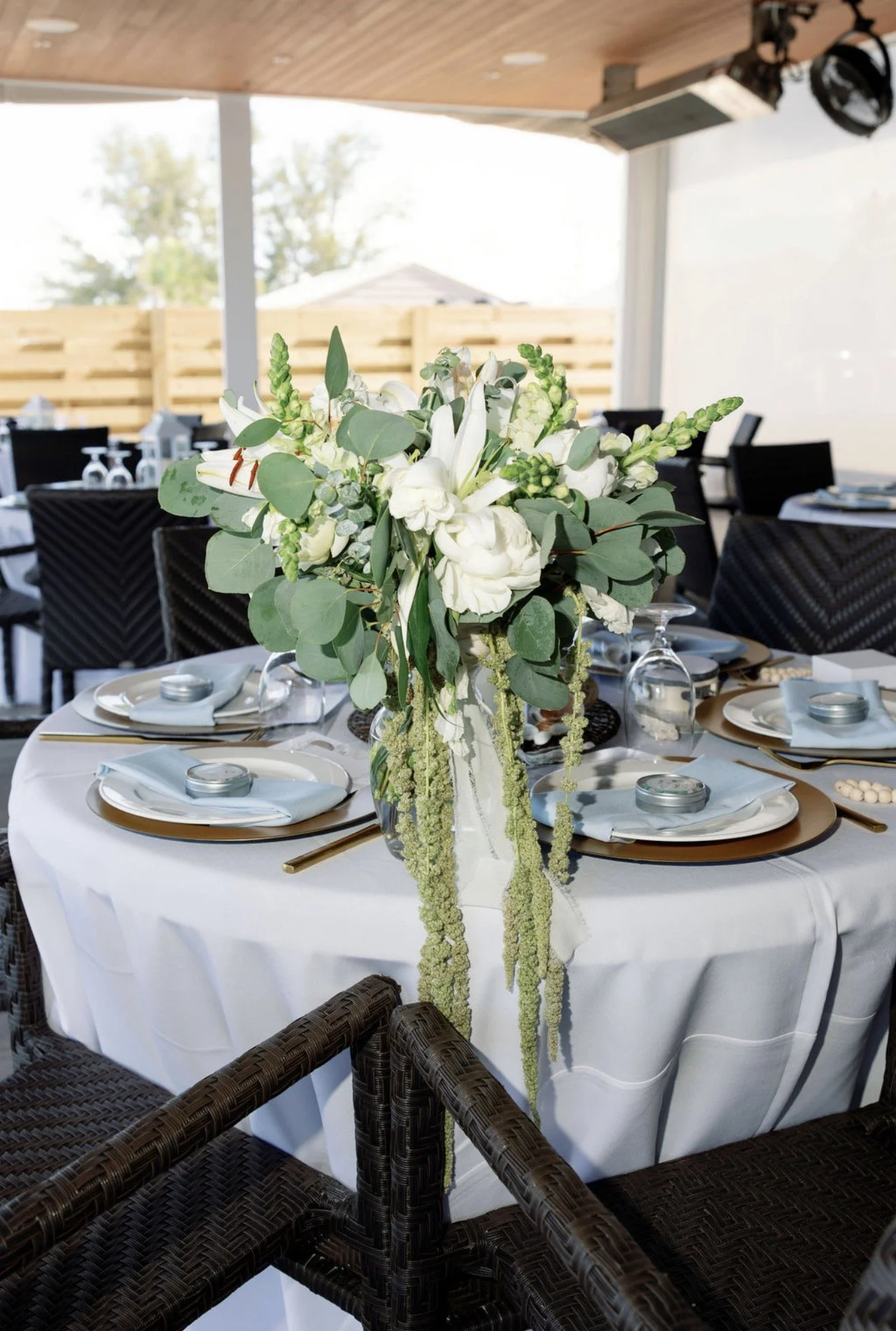 long-table-white-florals-brunch-buffet-setup-beach-house-anna-maria-island-wedding.png