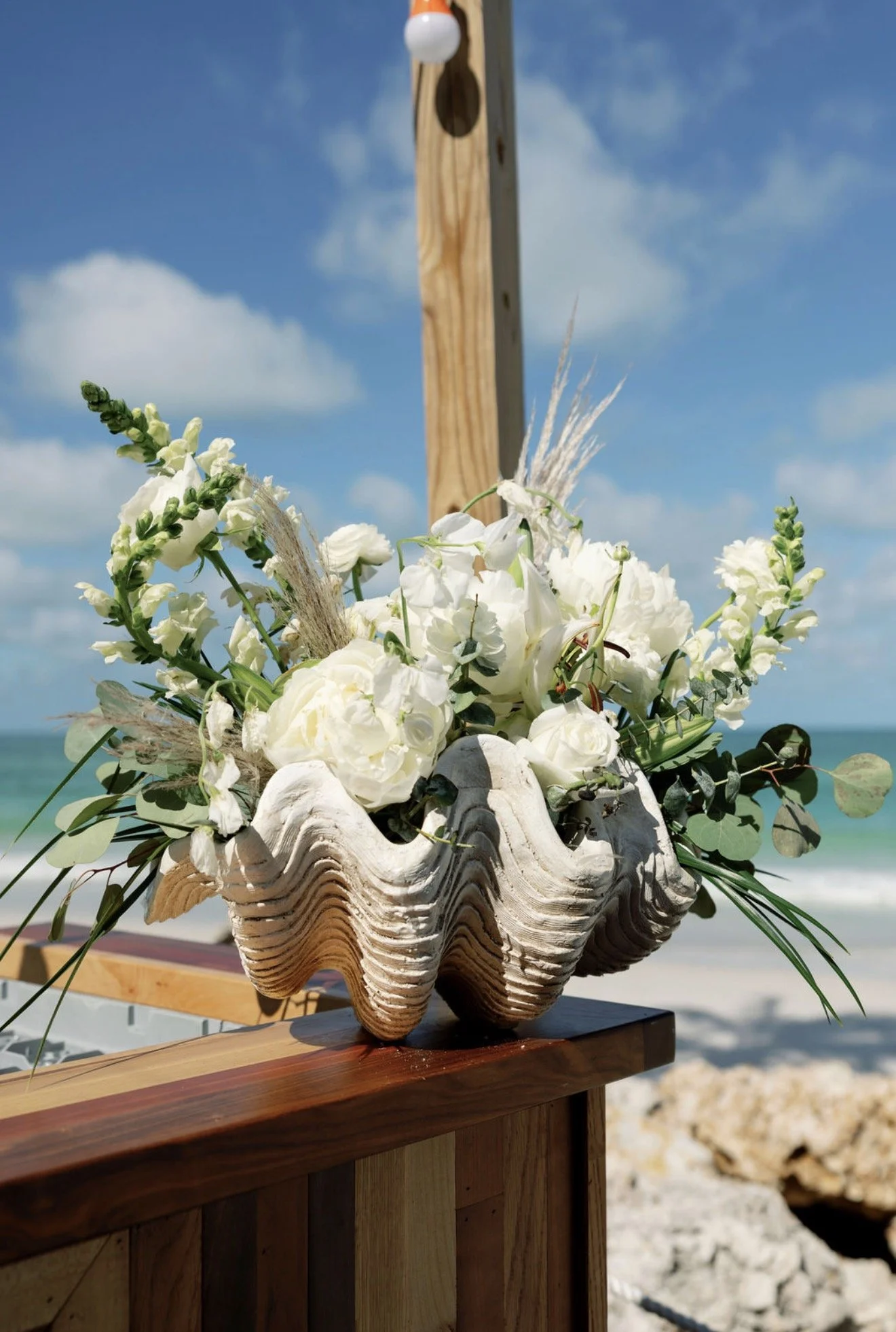 shell-floral-centerpiece-driftwood-beach-house-brunch-anna-maria-island-wedding.png