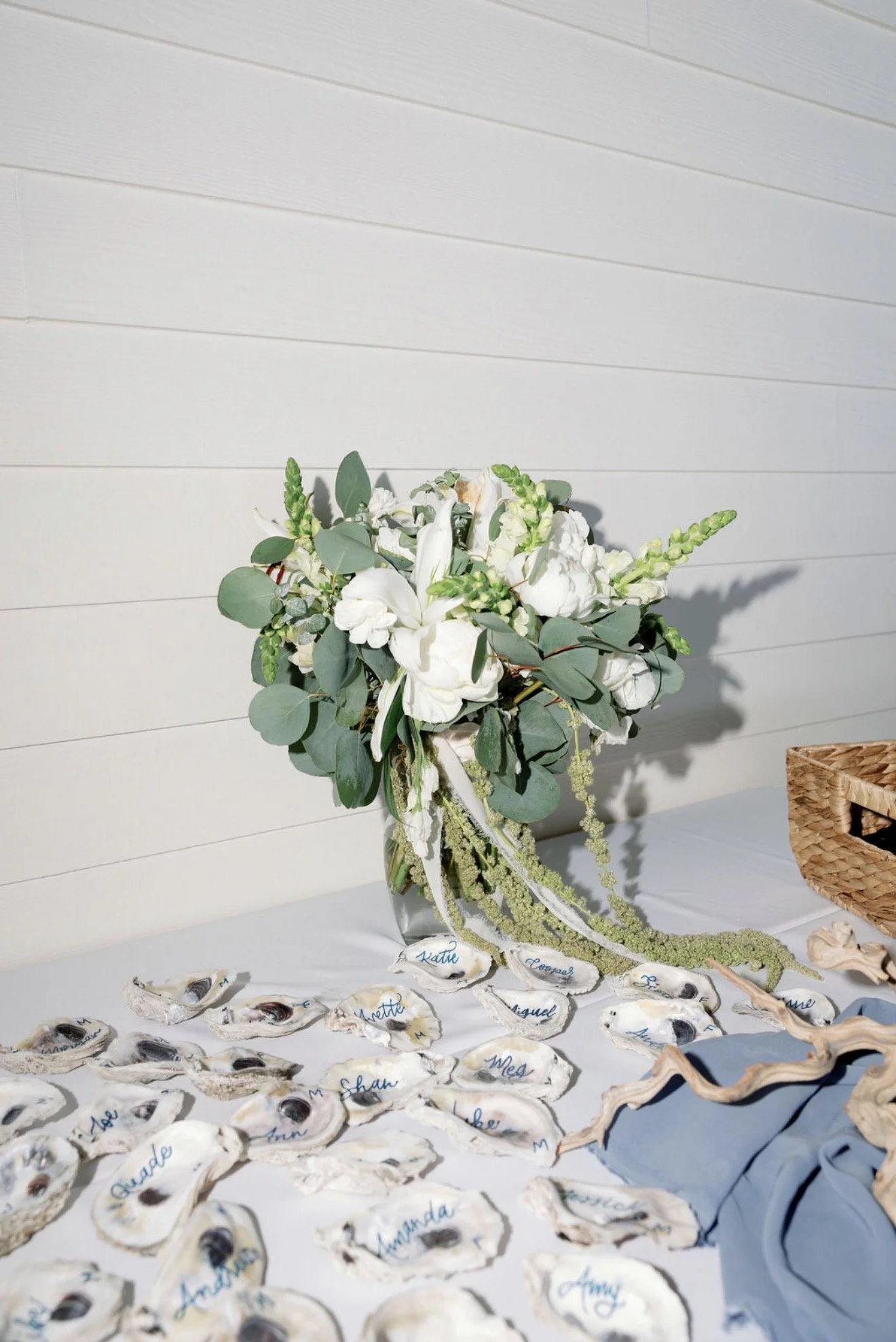 white-floral-greenery-centerpiece-beach-house-brunch-anna-maria-island-wedding.png