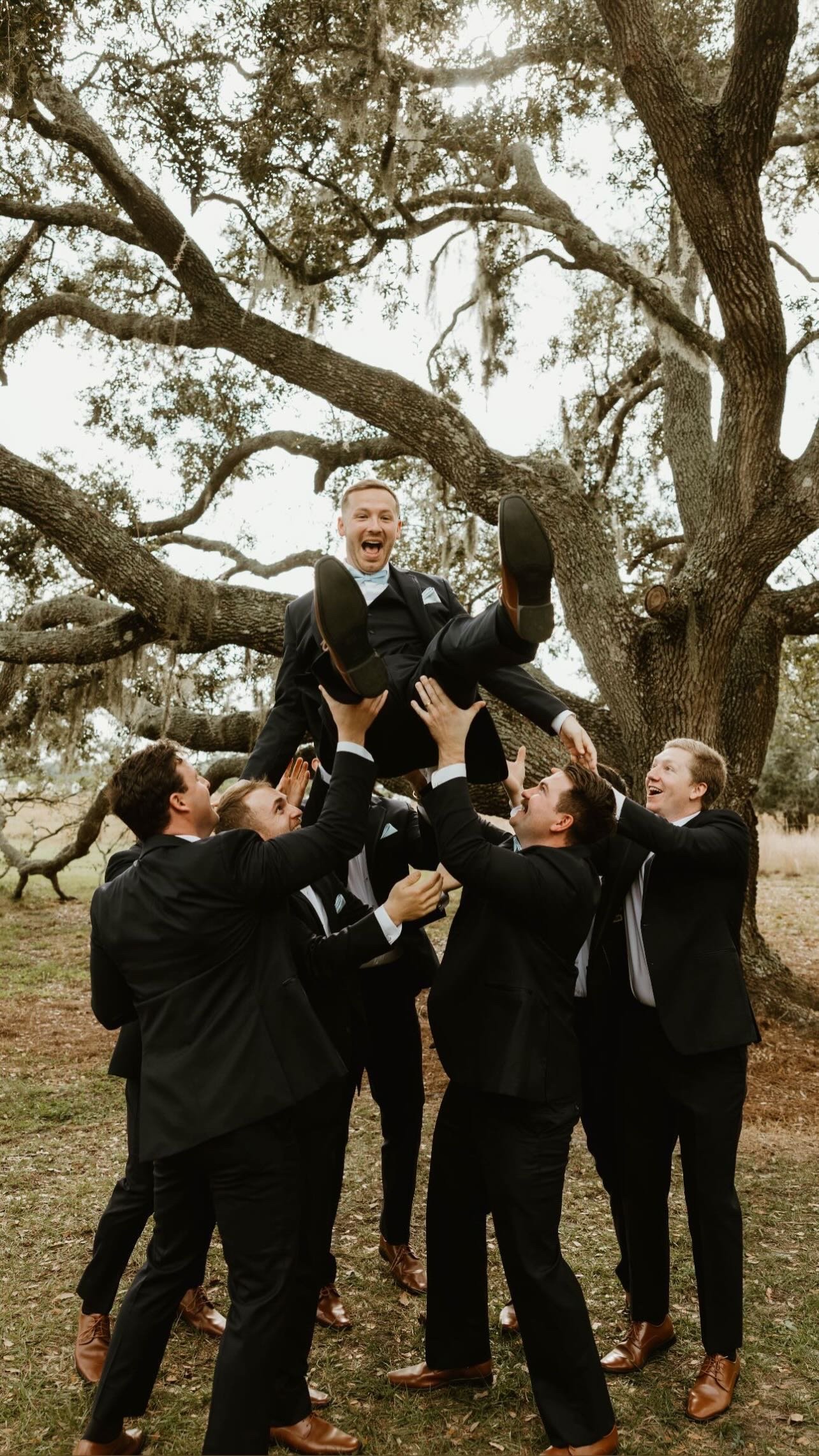 Joyful wedding party at Browns Grove, a Sarasota orange grove wedding venue