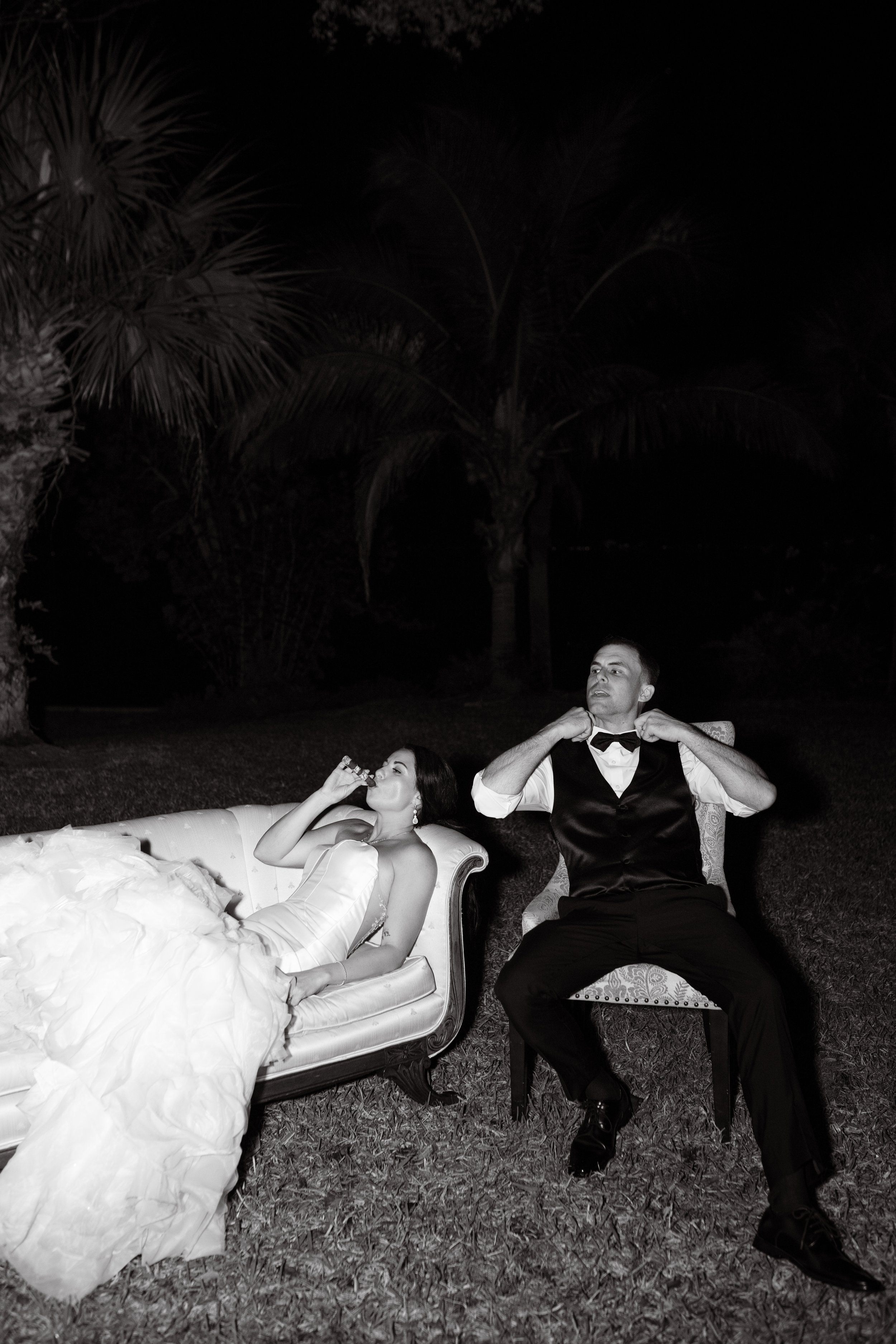 bride and groom smoking cigars so cool black and white wedding photography