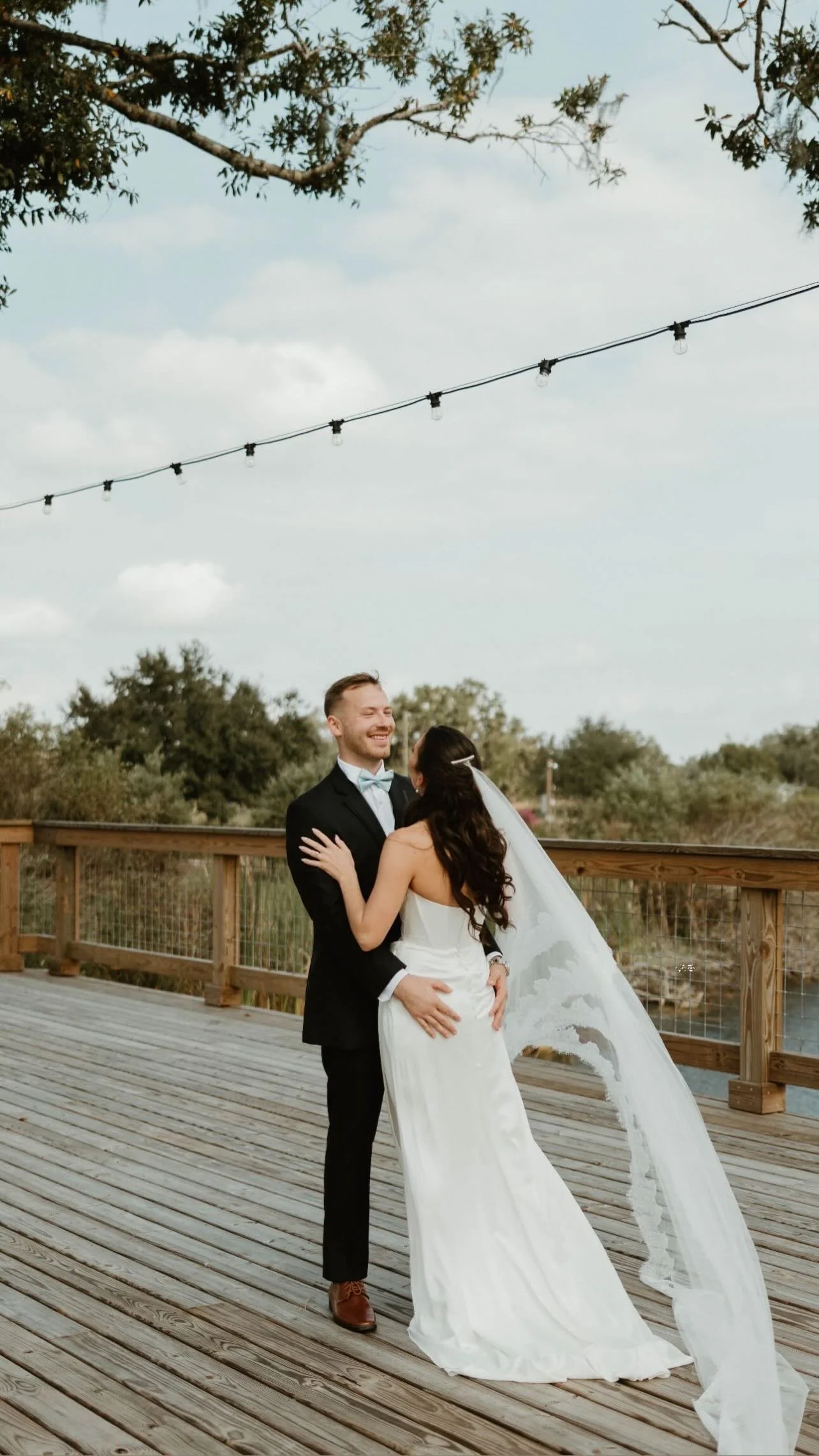 Couple portraits at a Sarasota wedding venue surrounded by orange trees