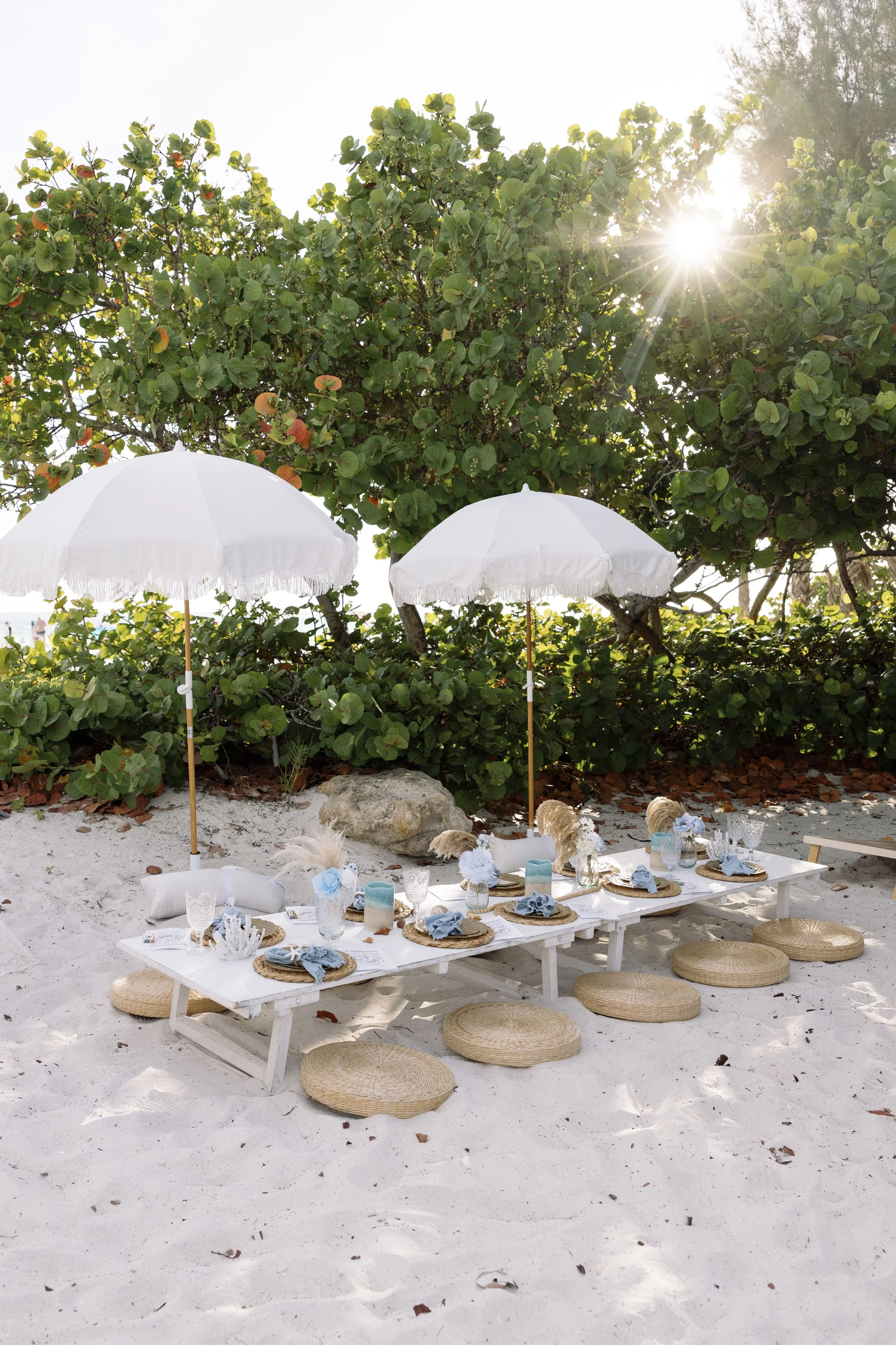 Dedicated kids space with personalized wedding activity books and shade from the summer heat.
