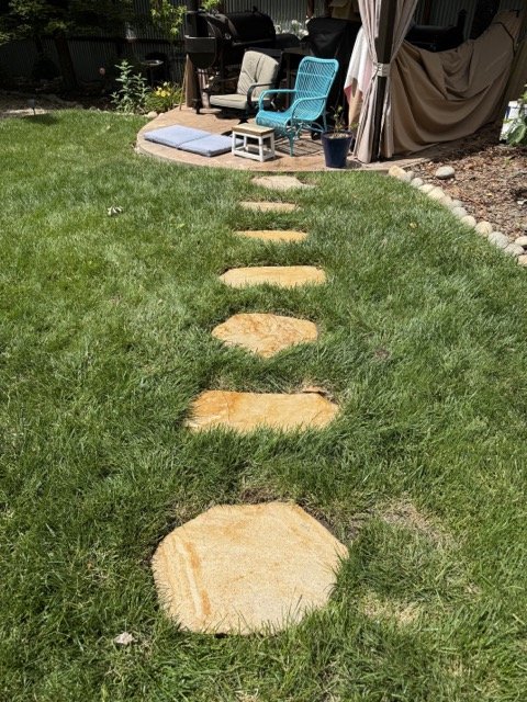Pathway stones- rolled sandstone in grass Medium.jpeg