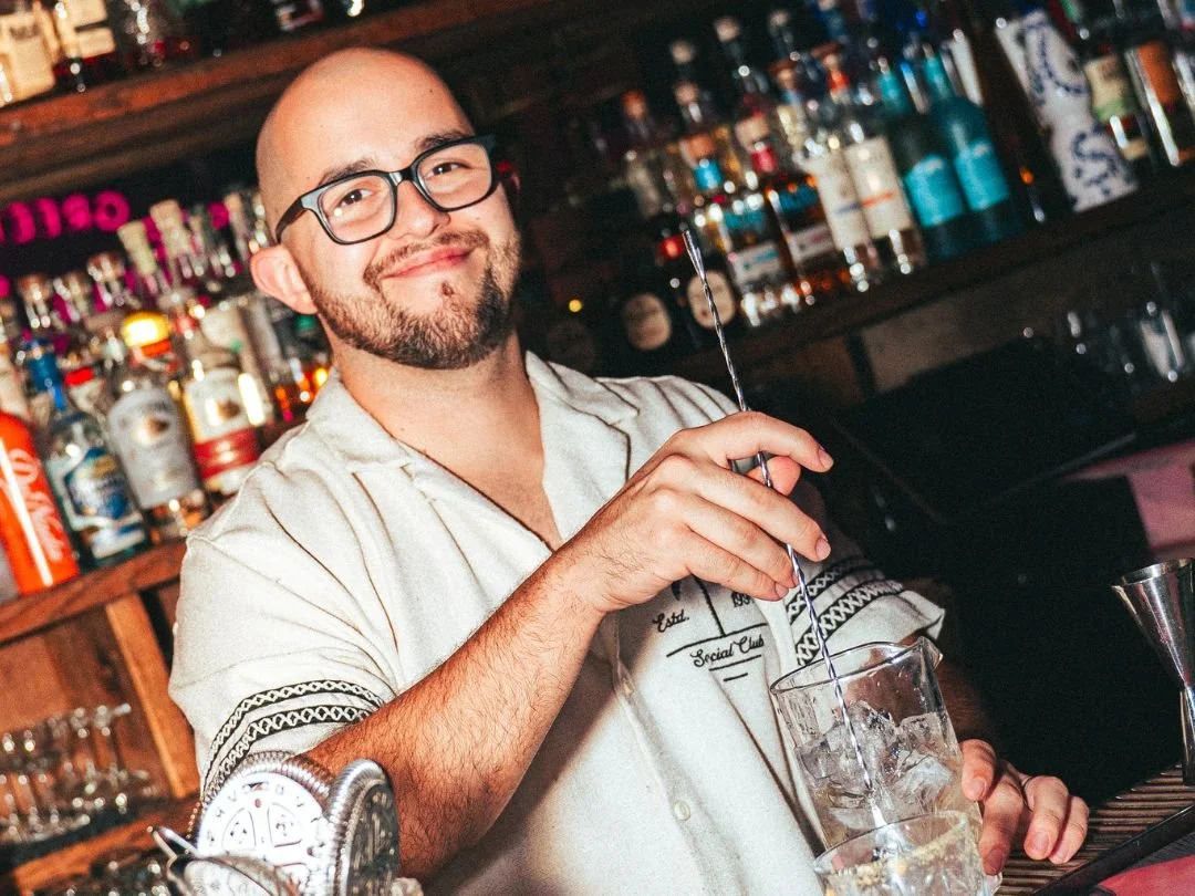 Bartender preparing craft cocktails at Tipsy Flamingo Cocktail Bar in Downtown Miami.