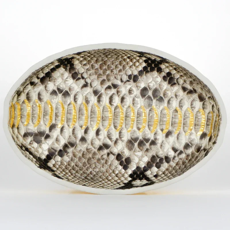 Tamed
9.125 x 6.25 x 1.5 in
Reticulated python leather, 24 karat gold leaf