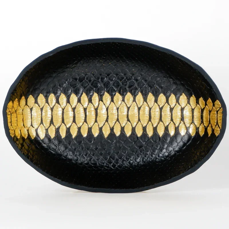 Sinister #4
7 x 10 x 1.875 in
Reticulated python, leather, dye, 24 karat gold leaf