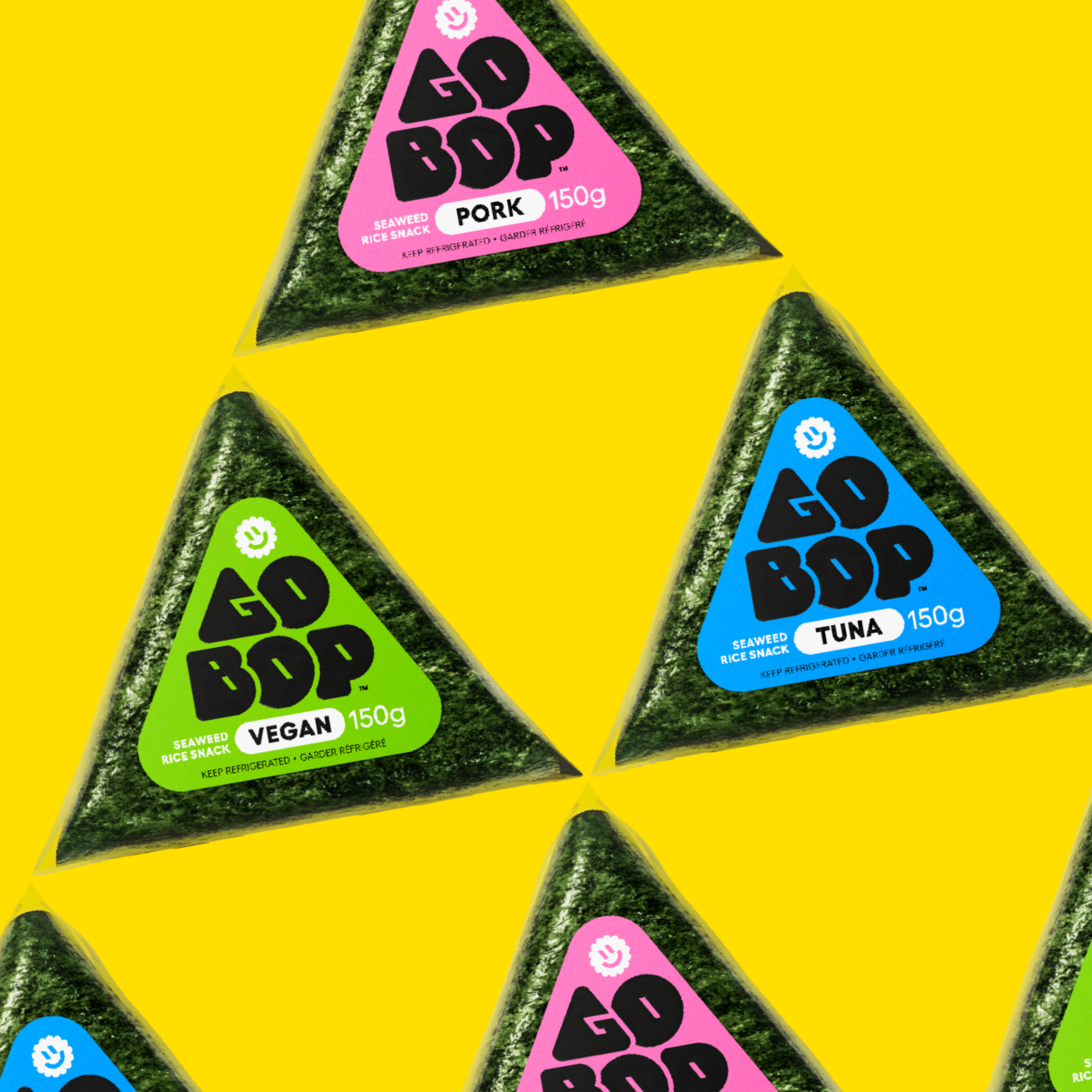 A variety of Go-bop triangle snacks in pink, blue, and green packaging on a yellow background.