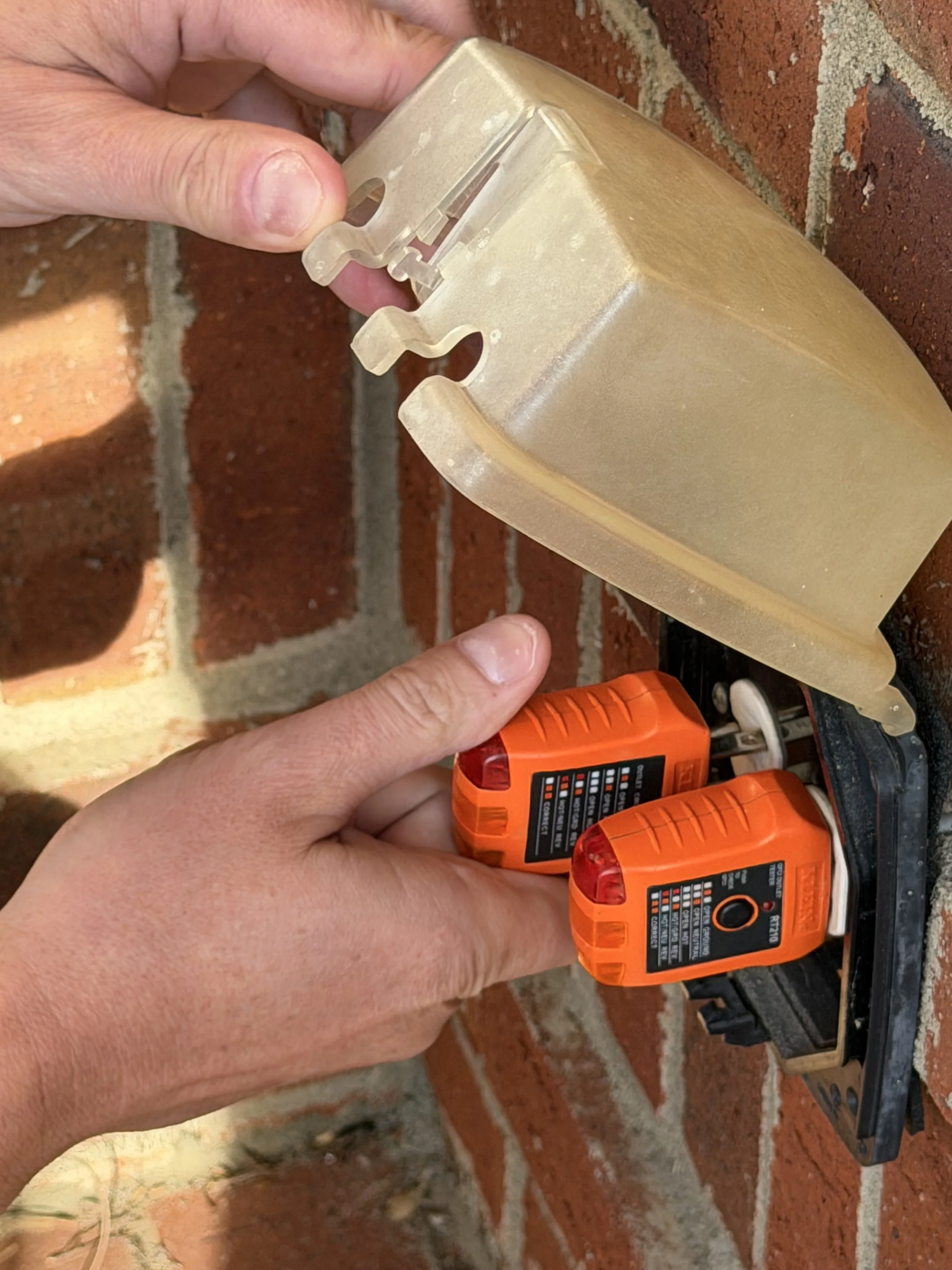 Home Inspector testing outside GFI