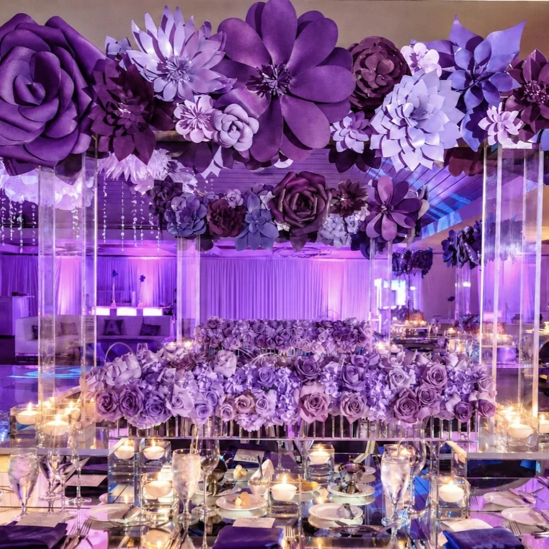 Handcrafted paper flowers, made for our Bat Mitzvah girl who wanted something different. 💜 We combined layered shades of flowers in purple shades to compleher whole look. When she said "different," we delivered.

#LinziEvents #bocaratonmit