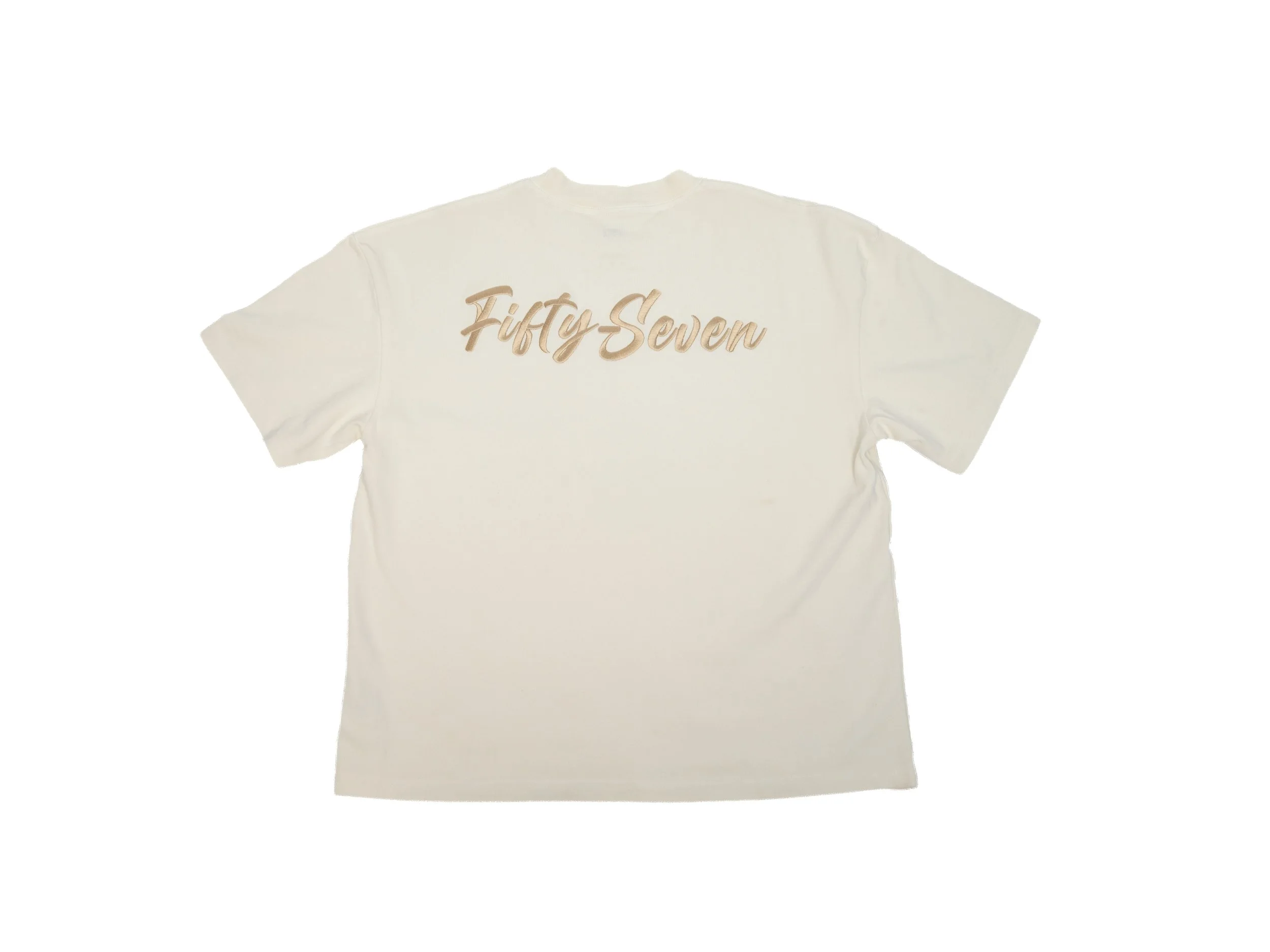 A cream T-shirt with the words 'Fifty Seven' written in gold script across the front.