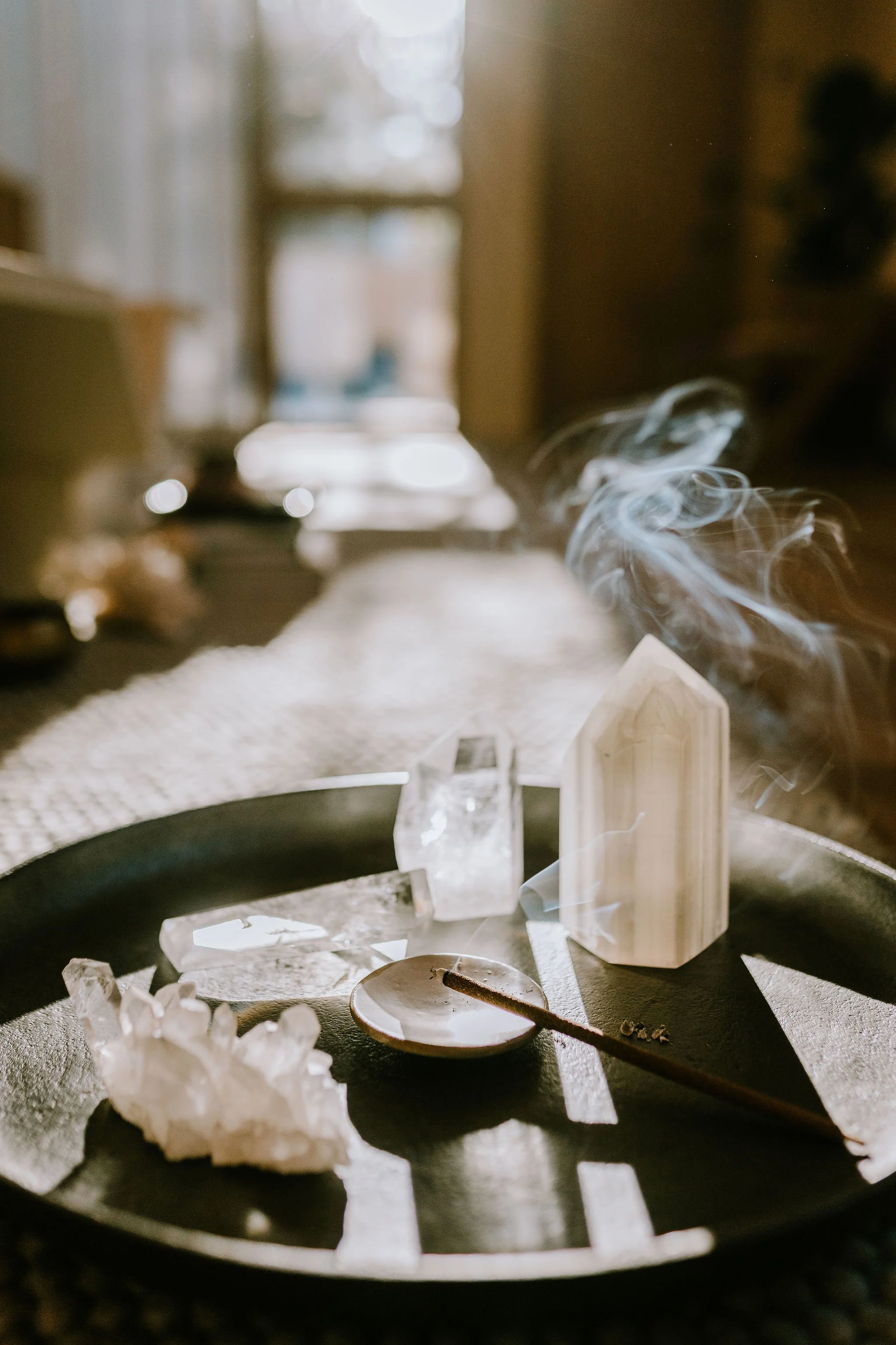 Crystals and incense on a tray in the wellness lounge at Innerhouse in North Austin