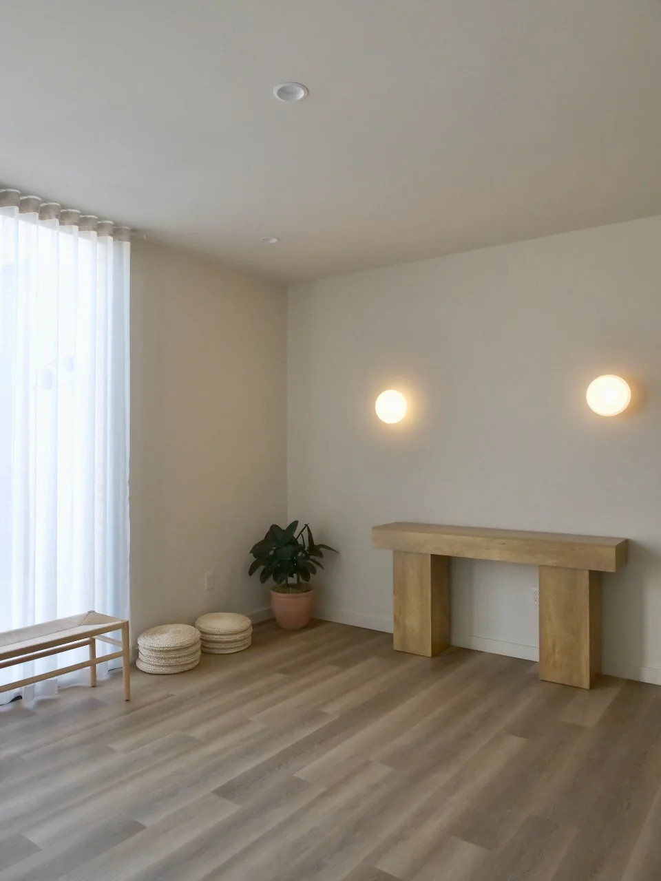 Small group wellness studio in North Austin with light wood flooring and natural light