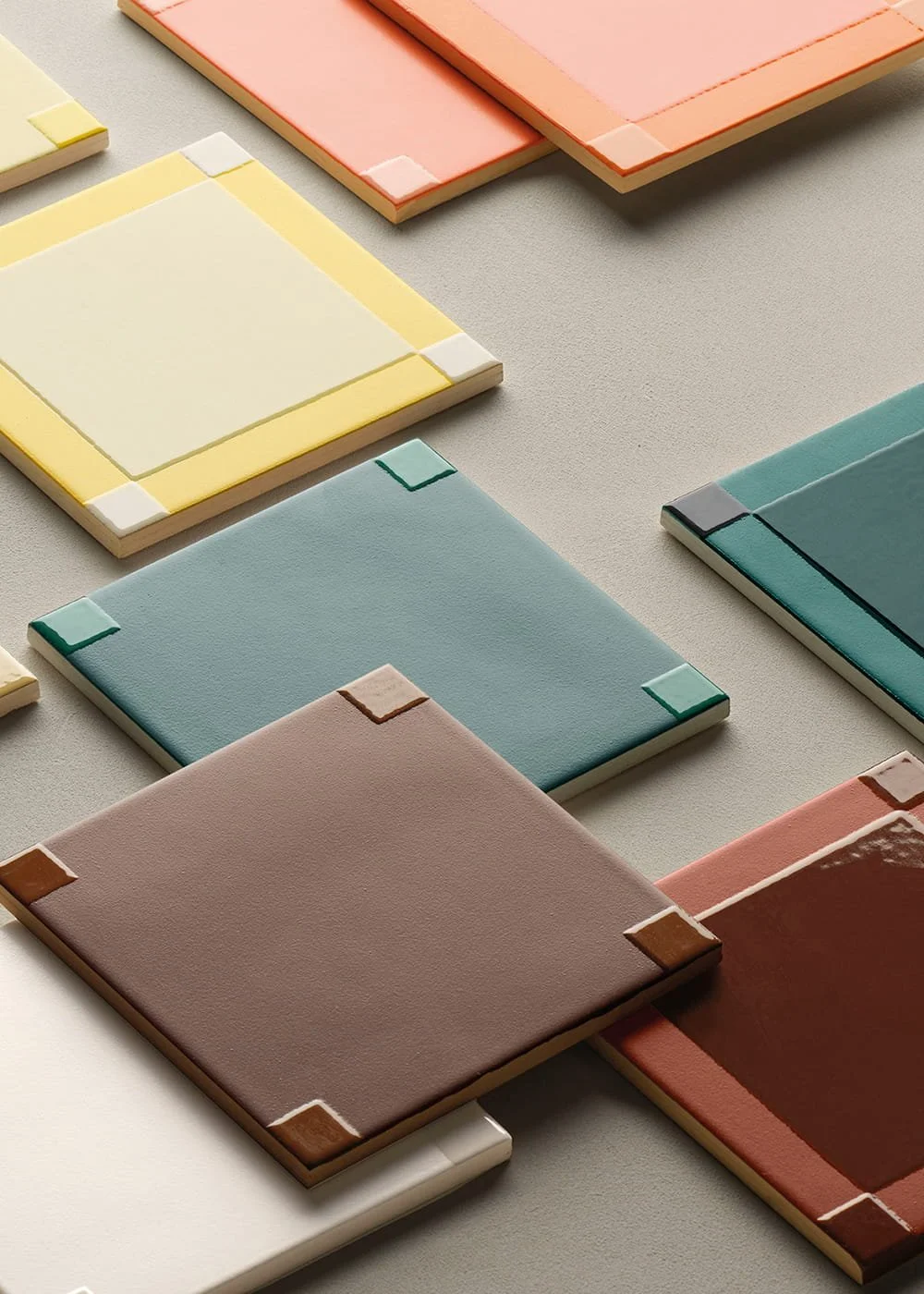 Colorful square ceramic tile composition inspired by Josef Albers Homage to the Square, featuring layered geometric blocks in muted tones