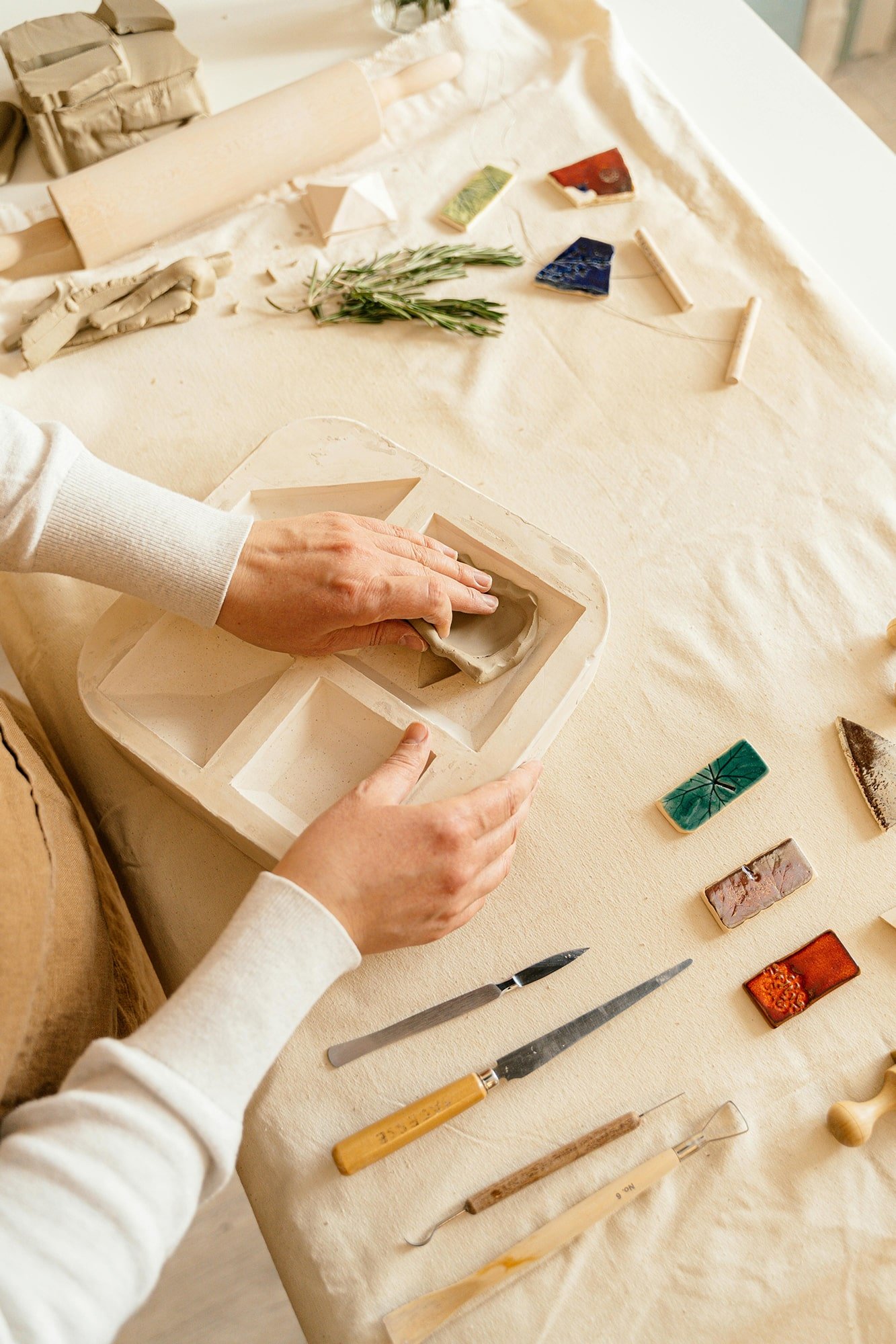 Interior designer reviewing ceramic tile samples and color swatches