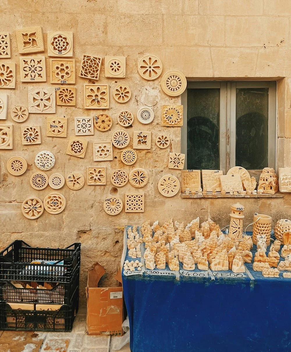 Exterior wall display of decorative handmade ceramic tiles in an Italian setting