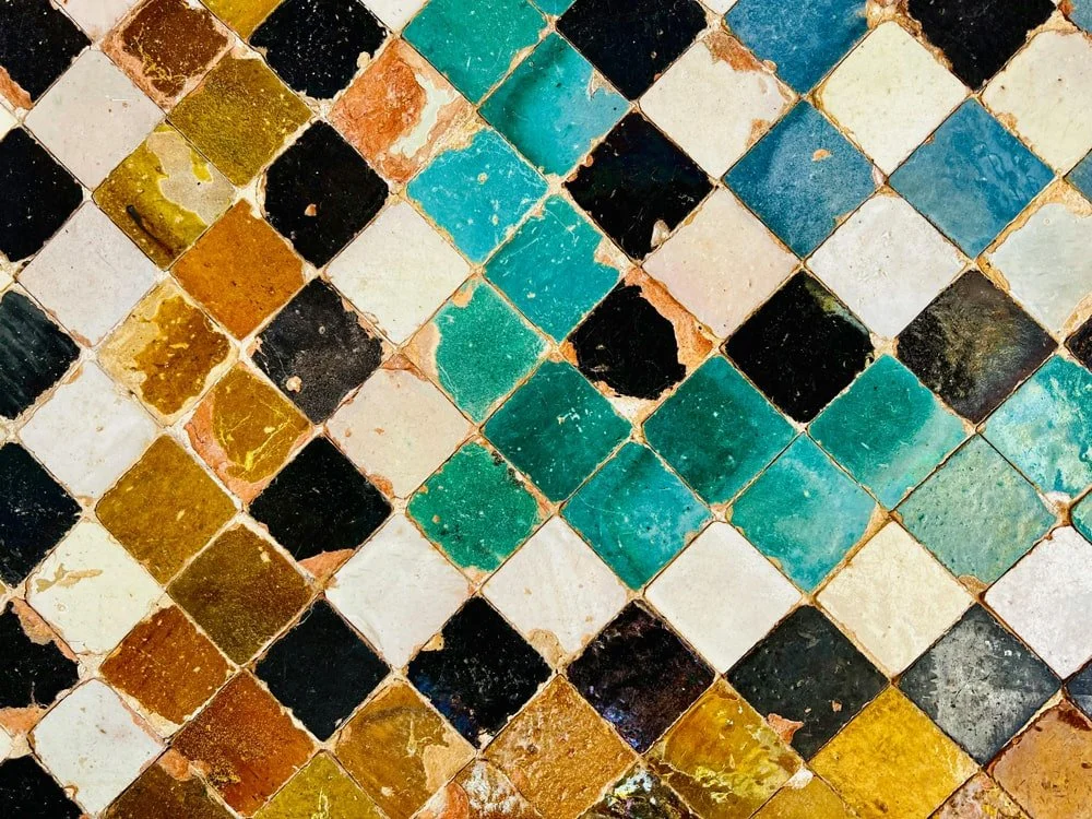 Hand-glazed ceramic tiles in varied earthy tones arranged in a checkerboard pattern